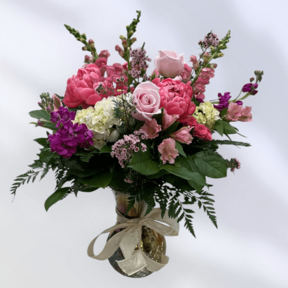 MD56 Peony Delight - Pink, peach, and lavender blooms are a sweet and innocent way to show your affection. Boasting a beautiful variety of flowers, including peonies and roses this chic bouquet of feminine colors is full of texture and makes a fabulous gift for any mom in your life.