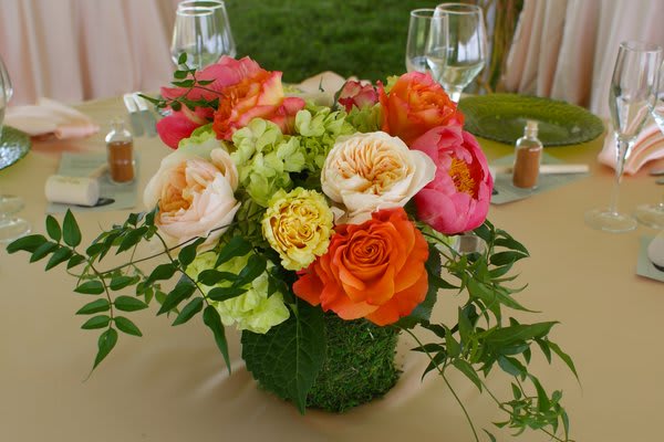 St Michael's - Garden roses, french peonies, hydrangea, Jasmine greens. Vase is wrapped in moss.