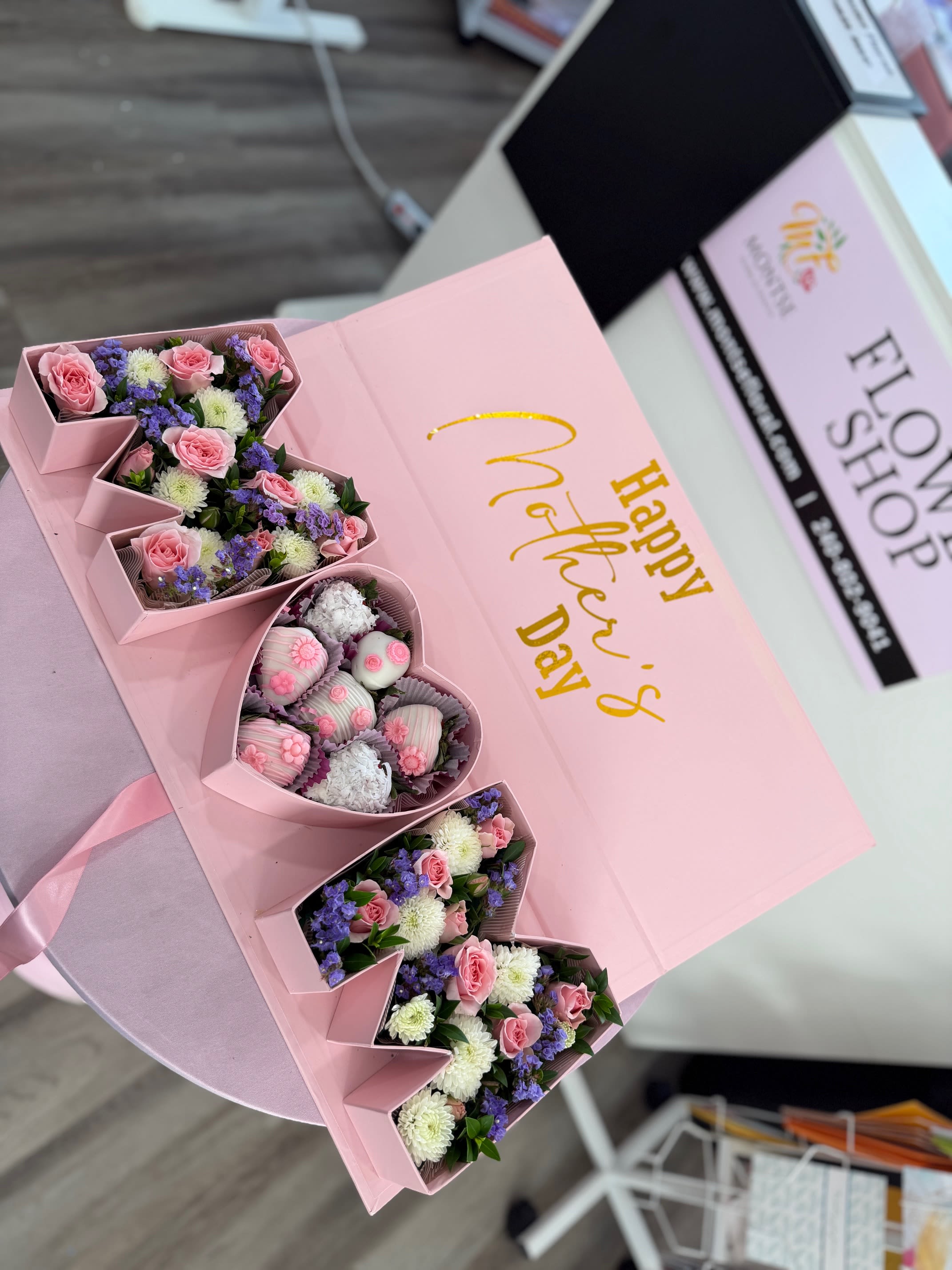 MOM Box  - Heart-shaped pink box filled with pink spray roses, white mums, purple fillers and chocolate covered strawberries.