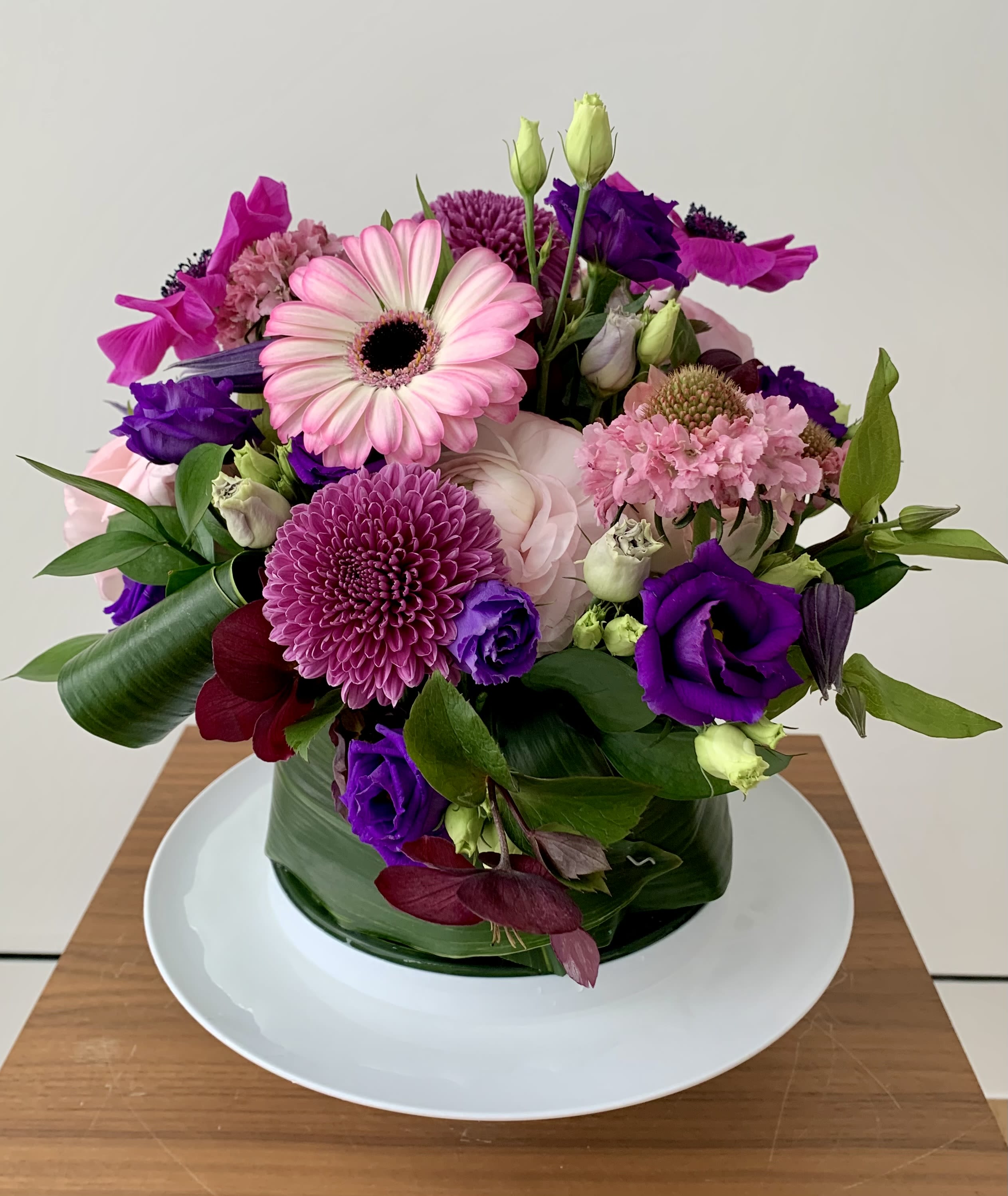 Pink and purple mixed bouquet in a glass vase