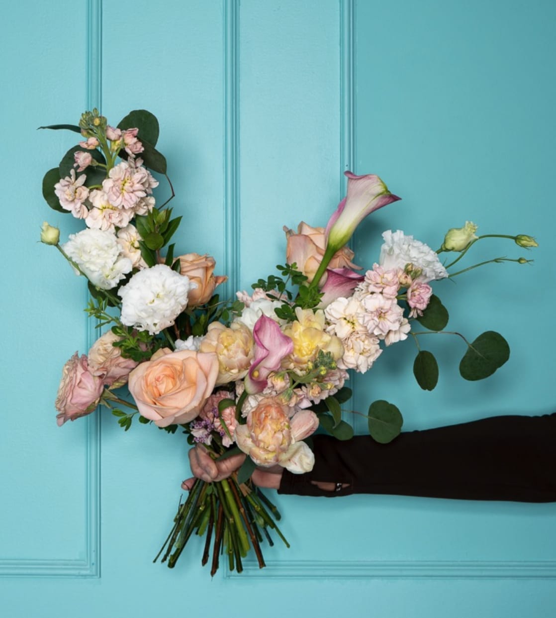 The Cheer Coach Tracy  - The Mrs. Tracy Collection: A Mother in Full Bloom is a love letter to the woman who holds it all together gracefully, powerfully, and with style. Inspired by a cheer coach, devoted wife, and mother/ grandmother, each arrangement embodies a different facet of her: her discipline, warmth, playfulness, resilience, and elegance.  These florals are lush, joyful, and full of movement, just like the life Mrs. Tracy nurtured.   Designed in The Flower Pot BK’s signature aesthetic, this collection blends vibrant blooms with delicate textures, creating arrangements that feel both celebratory and deeply personal.  This is for the mothers who lead, love loudly, and make beauty out of everything they touch.  *Arrangements come as designed in the vase or box if pictured, wrapped in our signature paper if no vase is shown. 