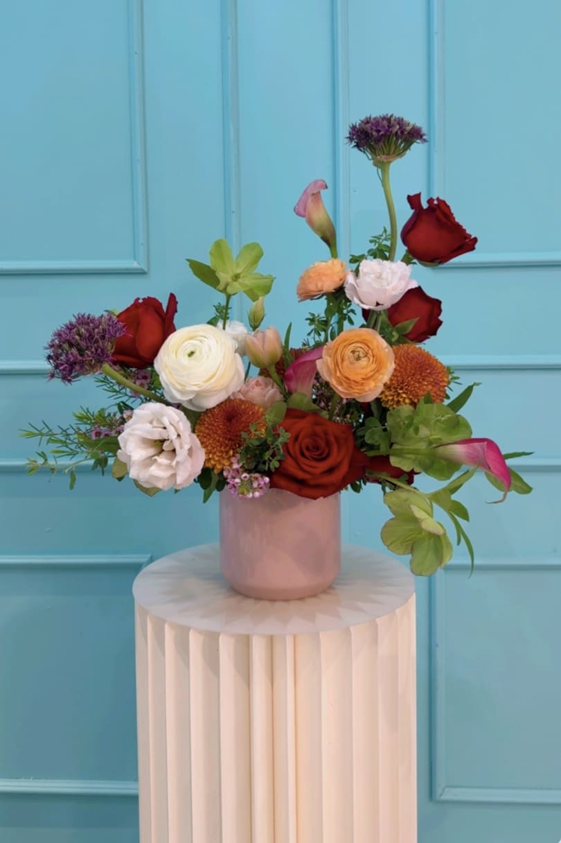 The Mother Tracy - The Mrs. Tracy Collection: A Mother in Full Bloom is a love letter to the woman who holds it all together gracefully, powerfully, and with style. Inspired by a cheer coach, devoted wife, and mother/ grandmother, each arrangement embodies a different facet of her: her discipline, warmth, playfulness, resilience, and elegance.  These florals are lush, joyful, and full of movement, just like the life Mrs. Tracy nurtured.   Designed in The Flower Pot BK’s signature aesthetic, this collection blends vibrant blooms with delicate textures, creating arrangements that feel both celebratory and deeply personal.  This is for the mothers who lead, love loudly, and make beauty out of everything they touch.  *Arrangements come as designed in the vase or box if pictured, wrapped in our signature paper if no vase is shown. 