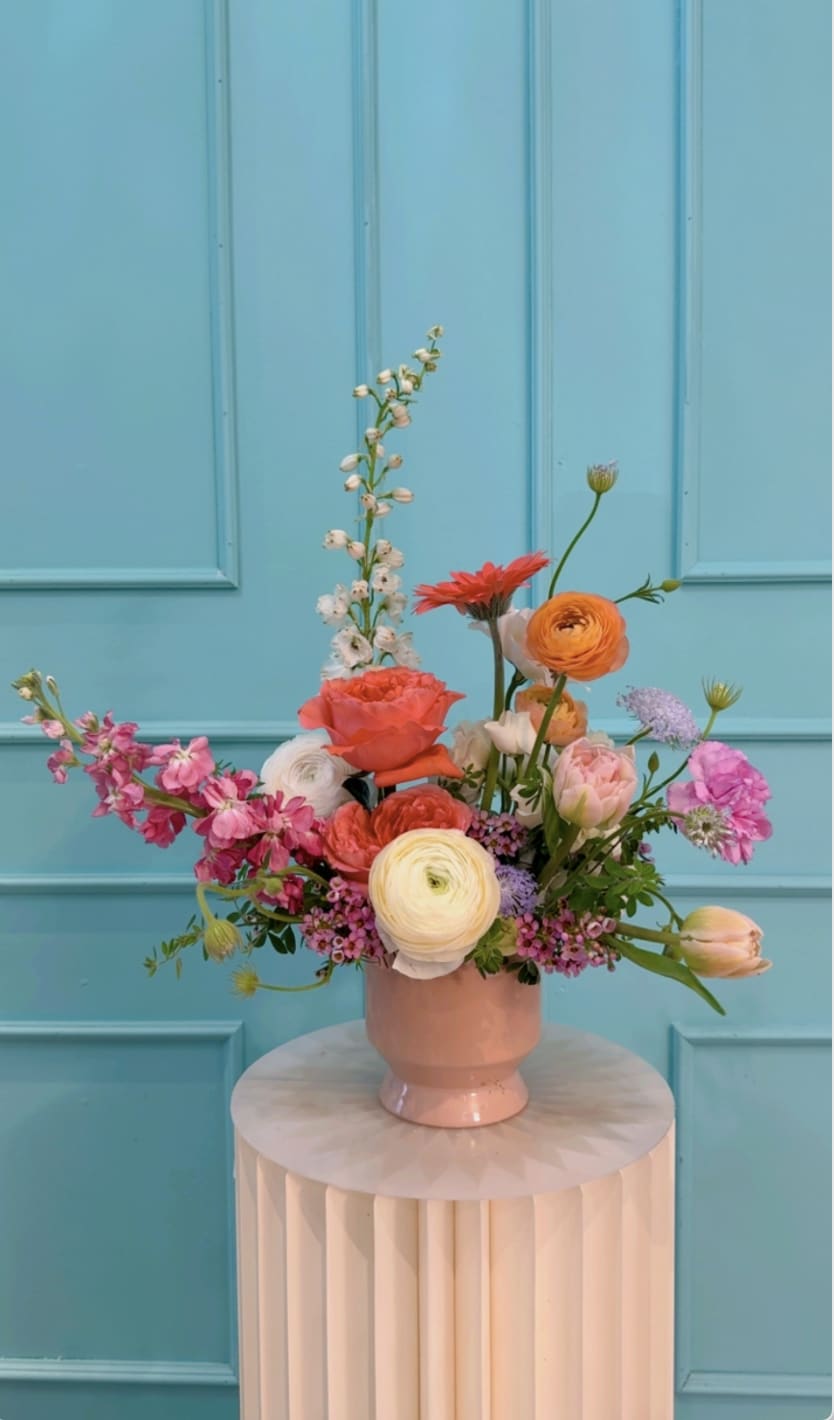 The Tracy in Bloom  - The Mrs. Tracy Collection: A Mother in Full Bloom is a love letter to the woman who holds it all together gracefully, powerfully, and with style. Inspired by a cheer coach, devoted wife, and mother/ grandmother, each arrangement embodies a different facet of her: her discipline, warmth, playfulness, resilience, and elegance.  These florals are lush, joyful, and full of movement, just like the life Mrs. Tracy nurtured.   Designed in The Flower Pot BK’s signature aesthetic, this collection blends vibrant blooms with delicate textures, creating arrangements that feel both celebratory and deeply personal.  This is for the mothers who lead, love loudly, and make beauty out of everything they touch.  *Arrangements come as designed in the vase or box if pictured, wrapped in our signature paper if no vase is shown. 