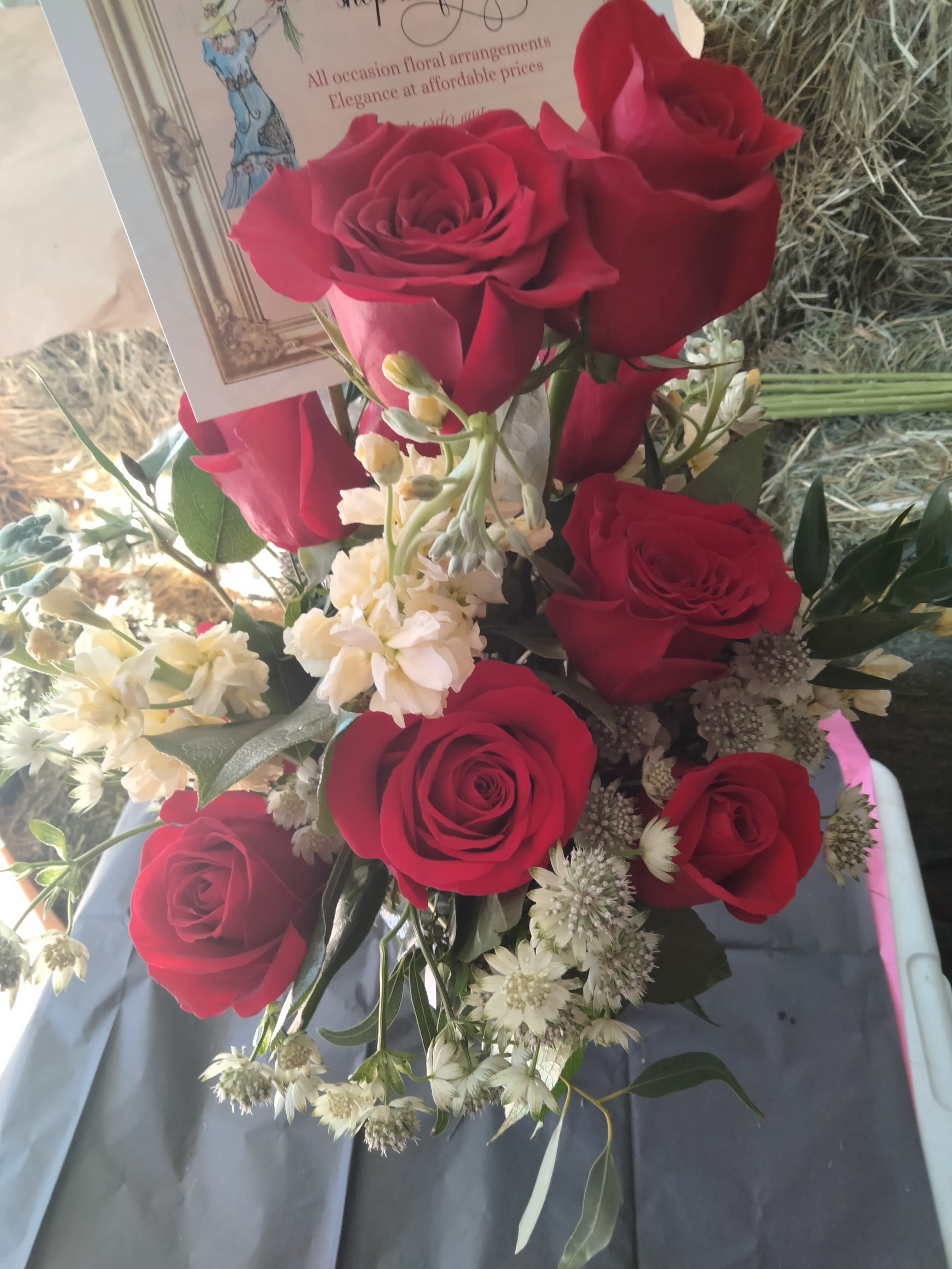 red means love - I got tired of seeing red roses with funeral ferns and babys breath. Next level your dozen oversized reds with delicate astrantia and chocolate queen annes lace with a dash of pale yellow sweet smelling stock. This would make any recipient happy!