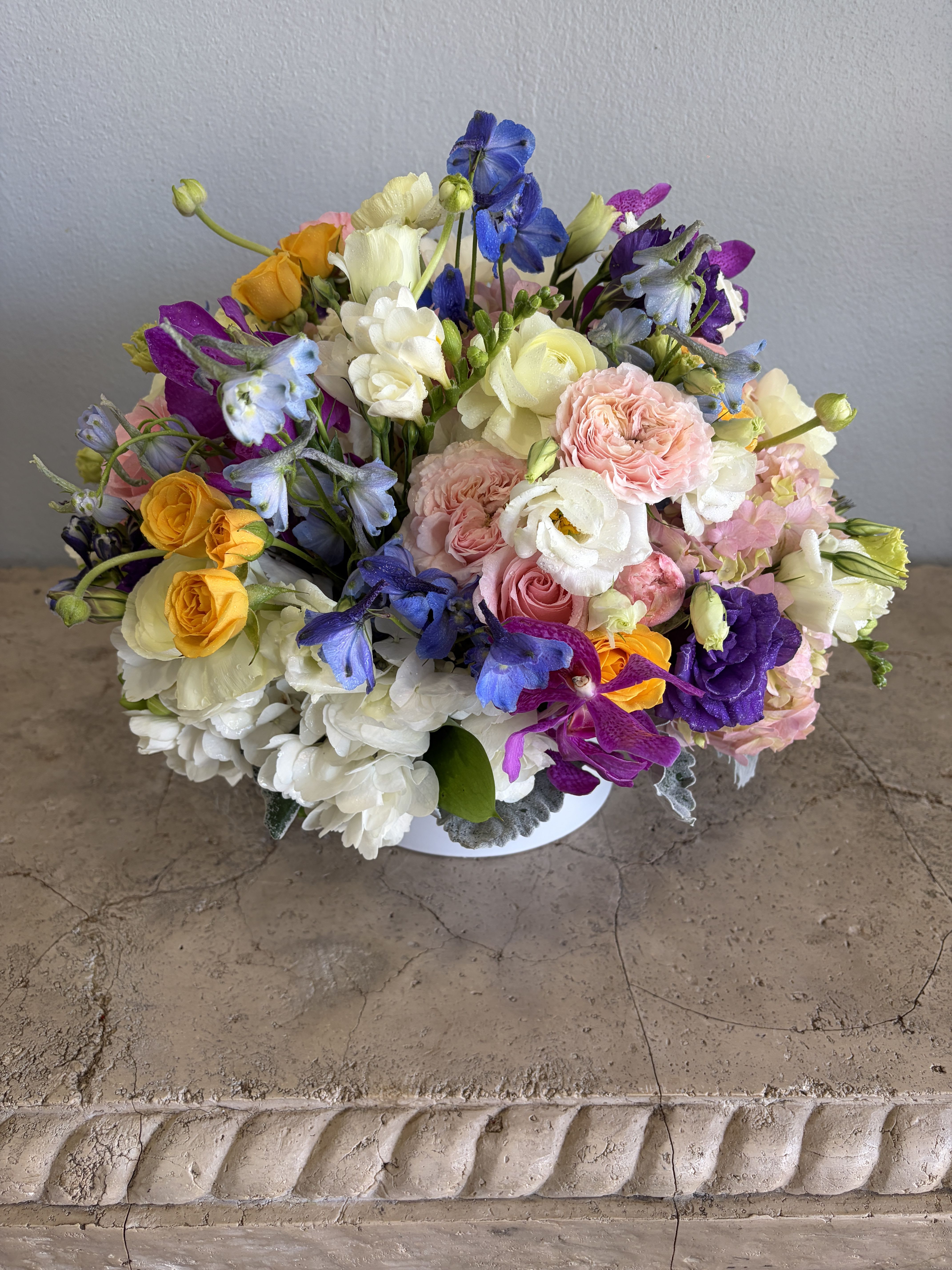 Mother's Heart - Pamper her with a grand display of lush seasonal blooms. A variety of pinks, whites, purples, blues including roses, hydrangeas, Lisianthus, orchids and so much more. Available for Mother's Day, Birthday, Anniversary, Just Because. Available for pickup or delivery in West palm Beach, Palm Beach and surrounding areas.