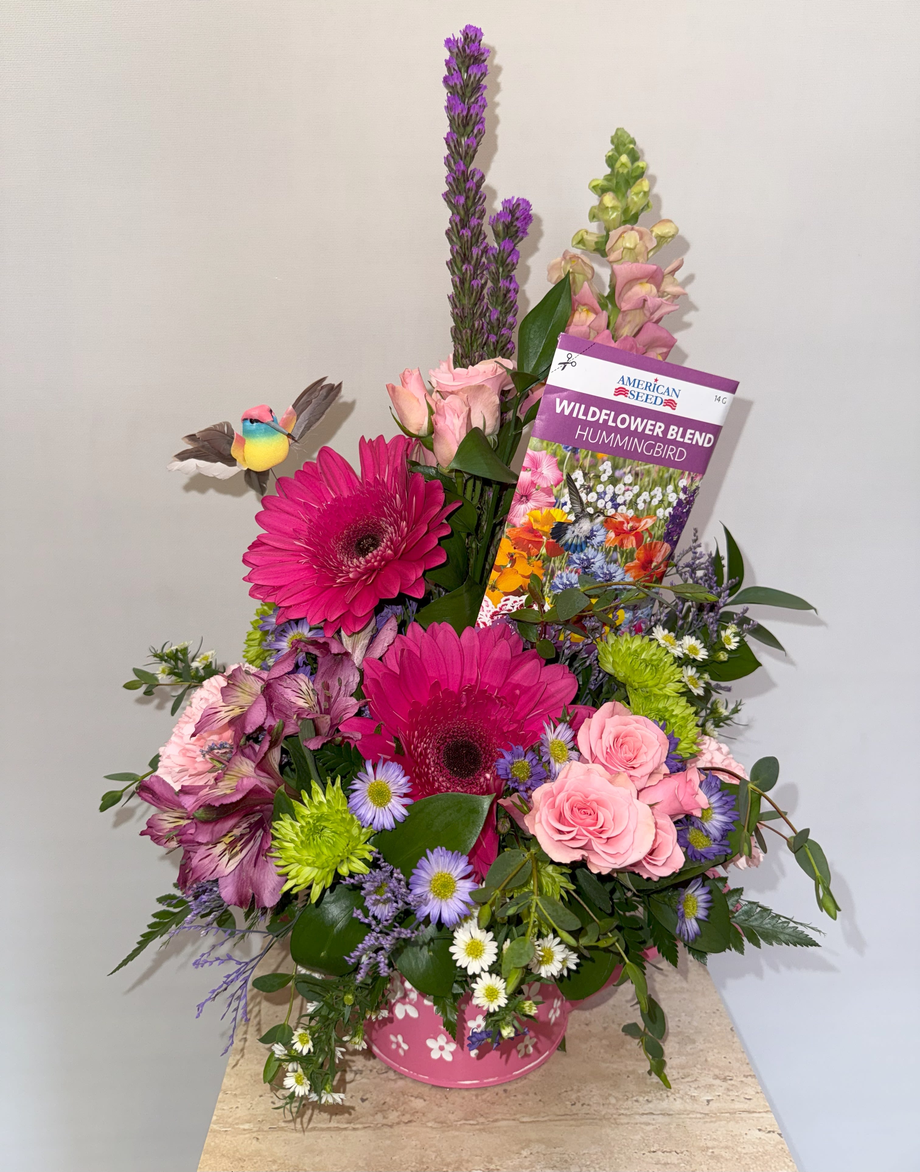 **MOTHER'S DAY SPECIAL** Spring Watering Can  - Featured in a colorful watering can, with a variety of colors and flowers; perfect for mom on mother's day. 