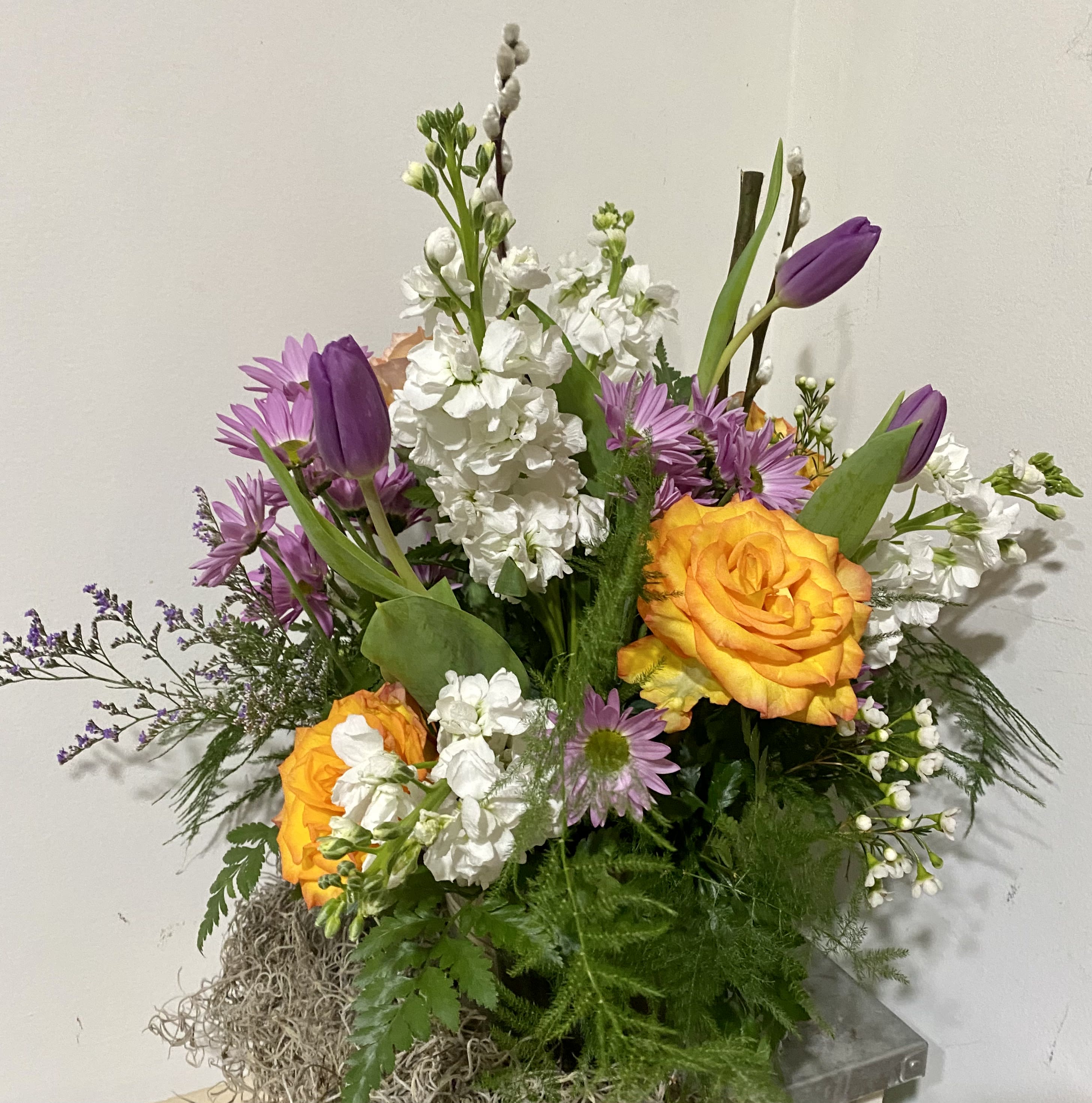 The French Broad Bouquet - A lovely mix of orange and purple flowers bursting in our humble tin pail.  (flower type may vary)