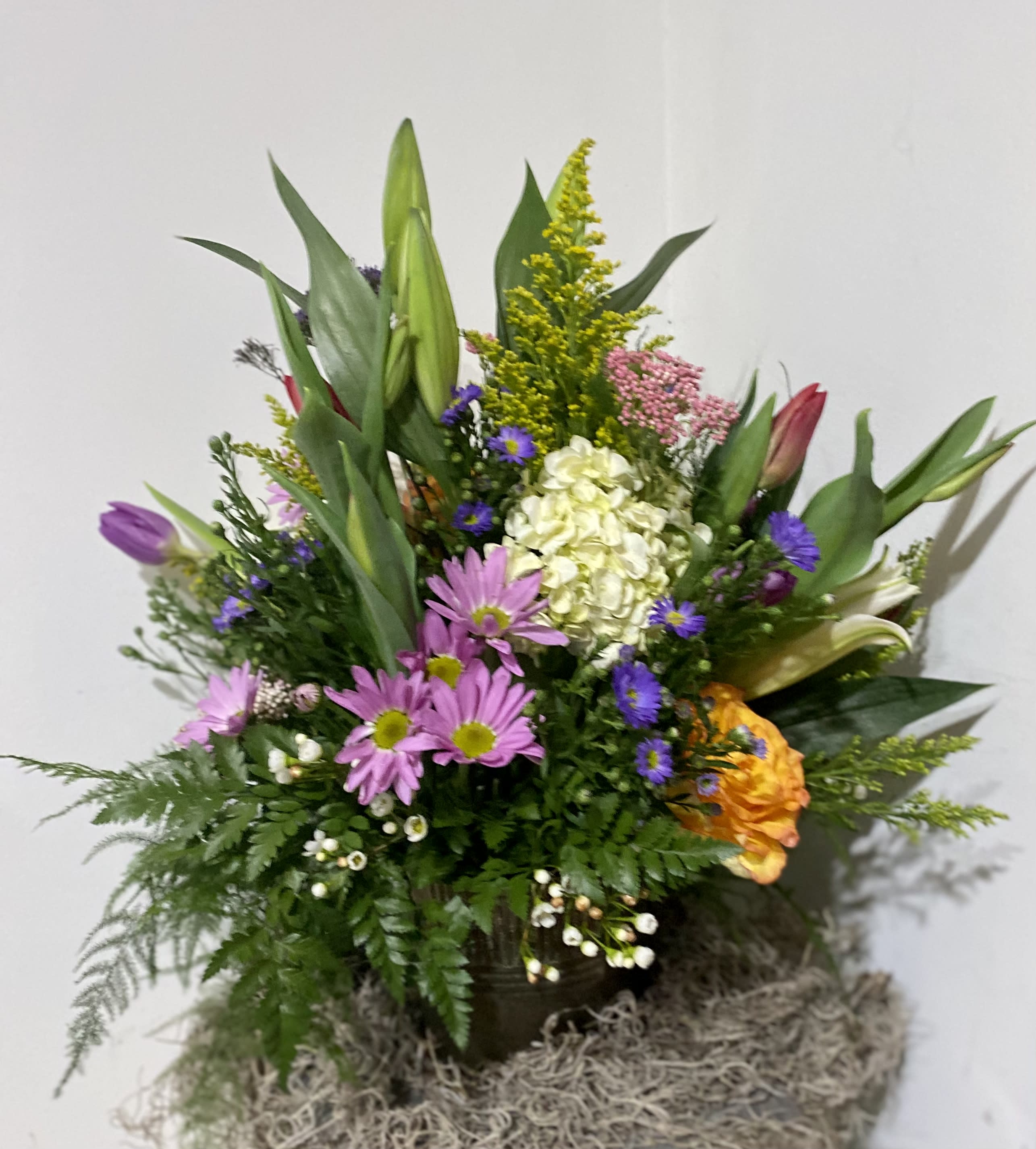 Wild Mountain Meadow - Blooms of all colors bursting from a tin pail (great re-usable vessel).  A true rainbow of blossoms.