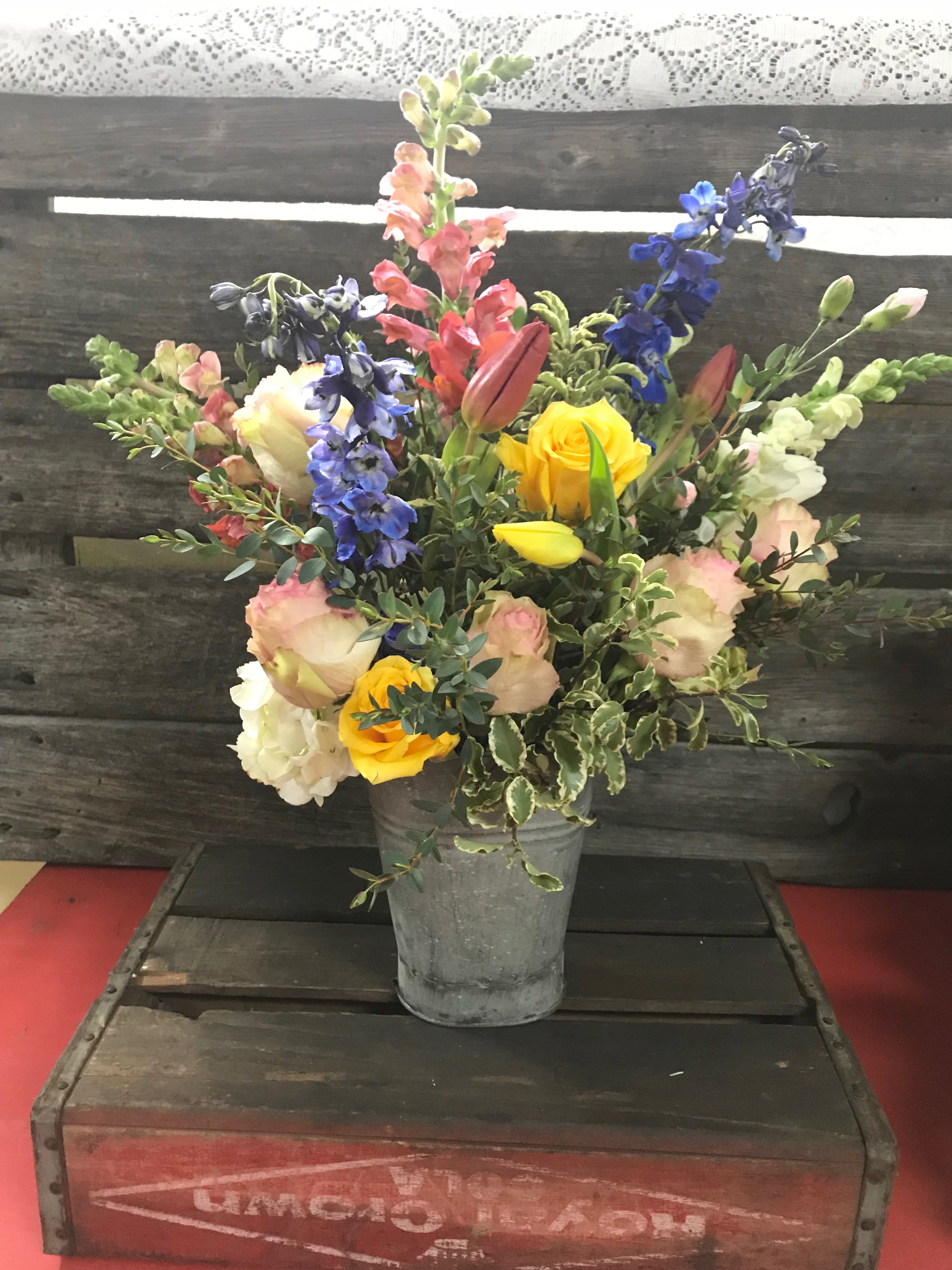 Mountain Garden - Lush variety of gardenesque blossoms bursting from a humble pail.  Perfect for the lady that loves her cutting garden and appreciates flowers on her kitchen table throughout the year.  It will remind her of her garden to come. 