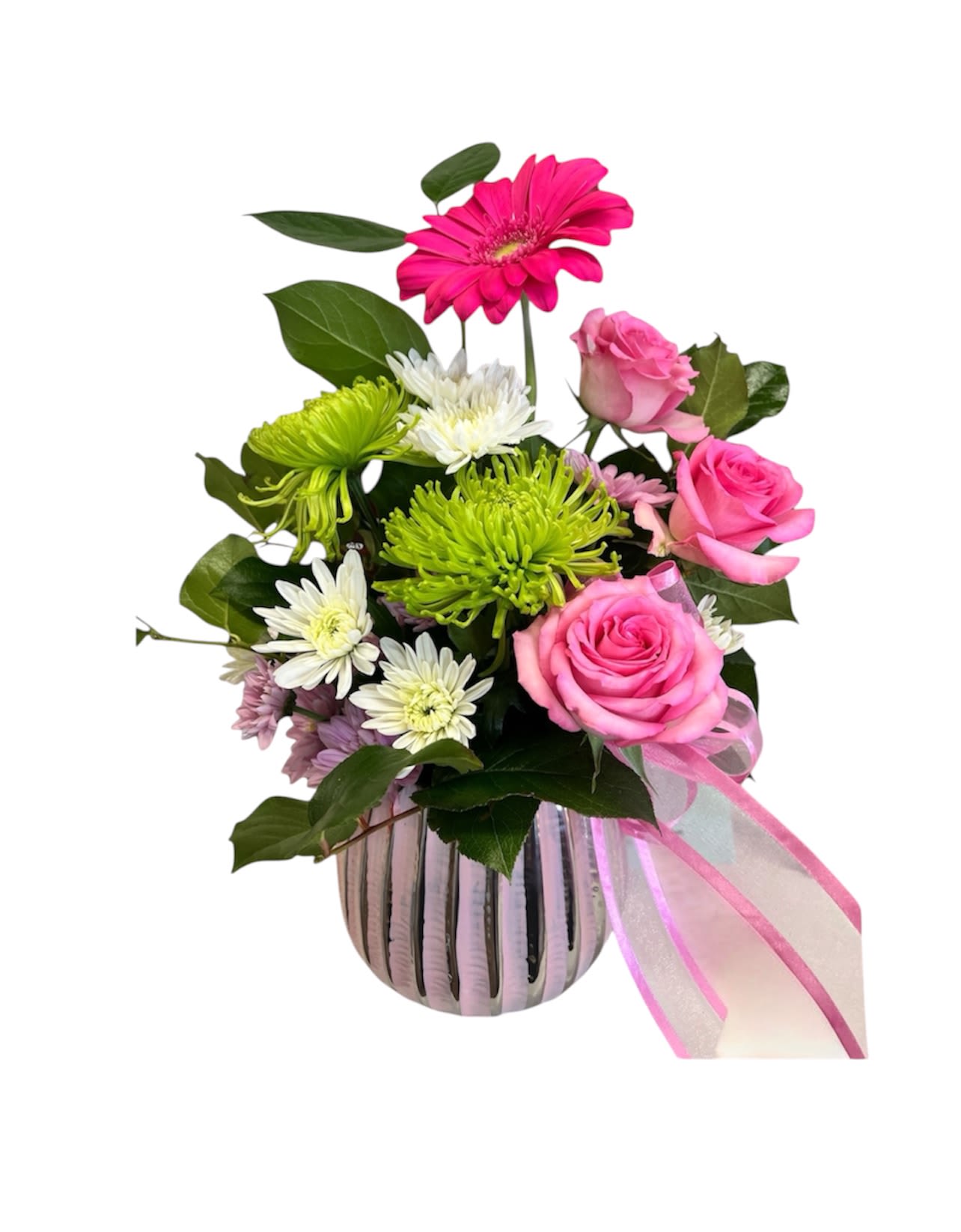 Mother’s Day! Pretty in Pink - A bright cluster of hot pink roses and a single vivid pink gerbera-style bloom makes this birthday bouquet pop - the kind of Pretty in Pink arrangement that makes the person you're thinking of grin the moment it arrives. Designed for birthdays, thank-you gifts, and spring celebrations, this cheerful mix of pink, white, green, and purple reads playful and uplifting so she'll feel celebrated and seen.  This arrangement pairs roses, daisies, and chrysanthemums in shades of hot pink, crisp white, and lime green, with a touch of purple for depth. The stems are gathered in a glossy striped ceramic vase and finished with a sheer pink organza ribbon draped to one side, creating a neat, modern silhouette that works on a mantel, desk, or dining table. Size and exact stem counts vary by availability; for freshest results, change vase water every 2-3 days and trim stems slightly when you refresh the water.