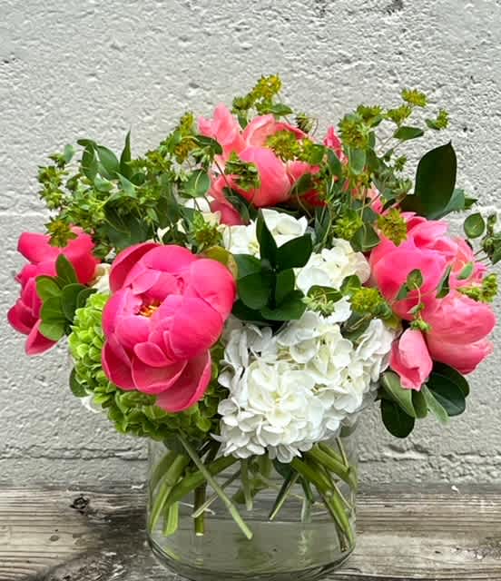 Rhapsody - Rhapsody is a springtime classic, with peonies (color may vary), green and white hydrangea, with bupleurum accents.