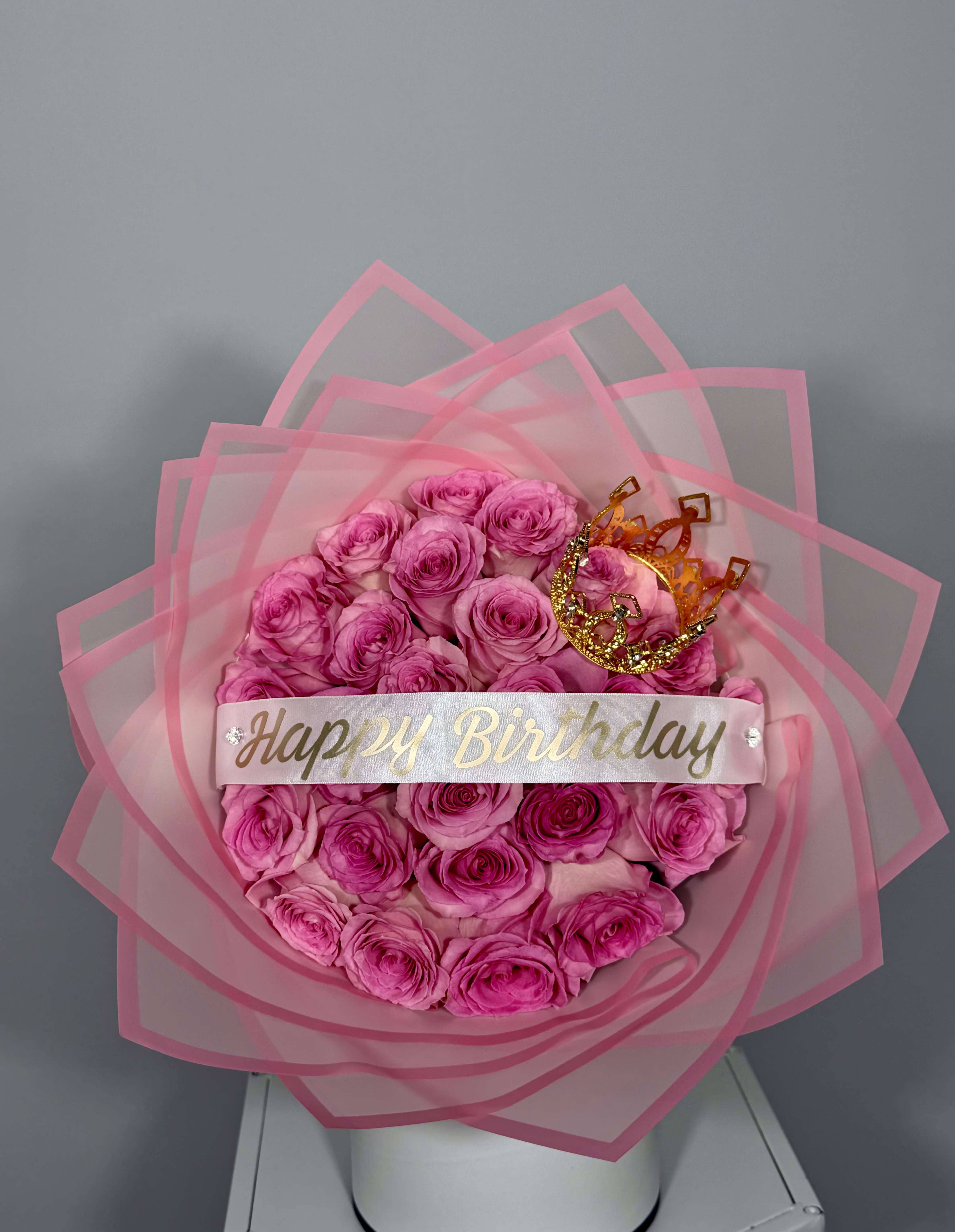 Princess Birthday Bouquet - Designed for those who love delicate and elegant details. Light pink roses wrapped in soft pink paper and topped with a unique crown touch that makes it simply magical. Perfect for birthdays.