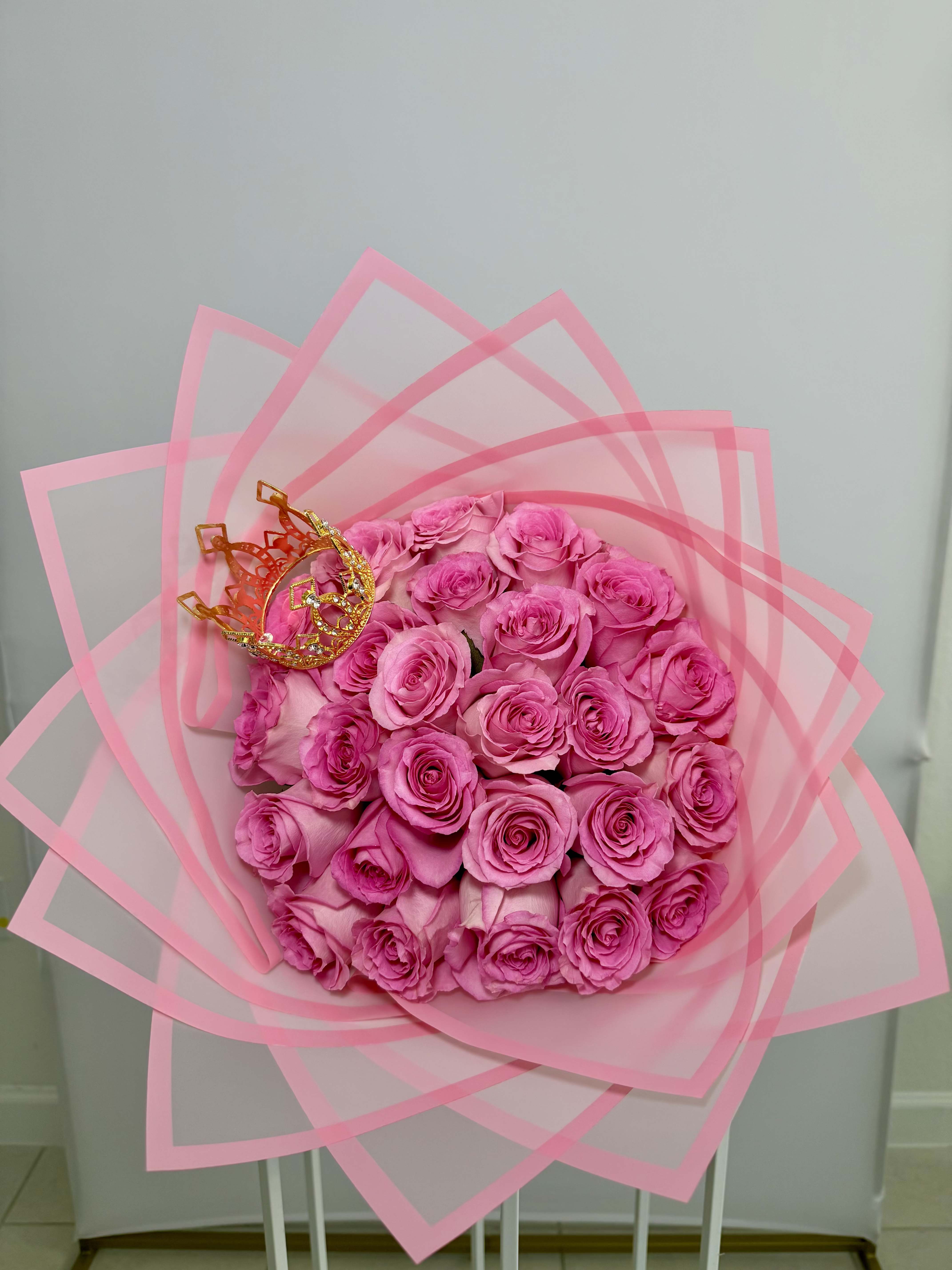 Princess Bouquet - Soft light pink roses wrapped in blush pink paper, topped with a delicate crown for that princess touch. 