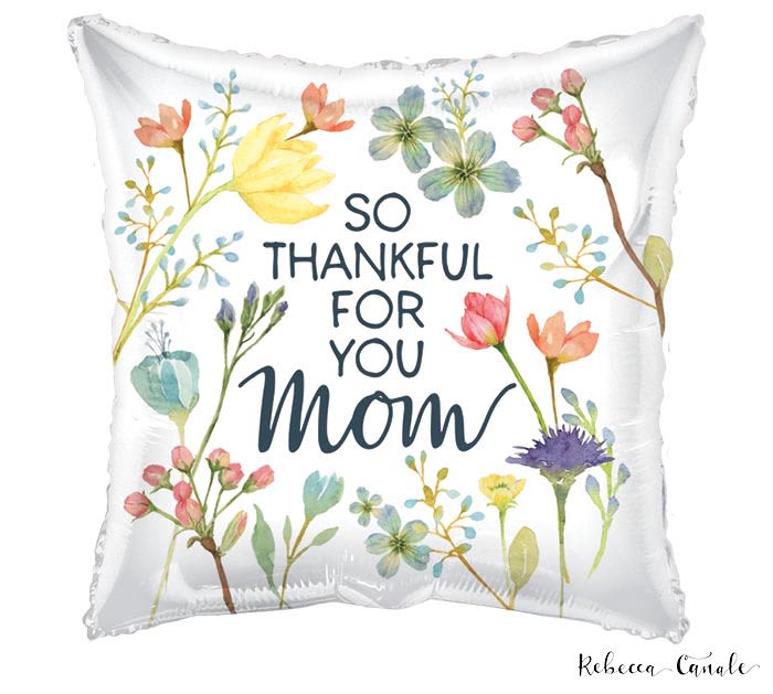 17" So Thankful For You Mom Balloon - A soft, sentimental gift that feels like a hug-this 17" So Thankful For You Mom pillow is perfect as a Mother's Day or thank-you present to let Mom know she's appreciated. The square white decorative pillow features a watercolor-style floral wreath of pastel pinks, yellows, blues and soft greens framing the hand-lettered message "So thankful for you Mom," giving it a warm, homey look that complements kitchen nooks, living rooms, or a cozy reading chair.  Crafted with a gentle fabric face and printed floral sprigs around the edges, the pillow brings floral charm without fresh flowers-an ideal keepsake for a mother who loves lasting, decorative gifts. At 17" square it's a comfortably sized accent piece that pairs well with other cushions or a small bouquet; order it alone or as an add-on to a floral delivery to create a thoughtful gift set that she'll treasure.