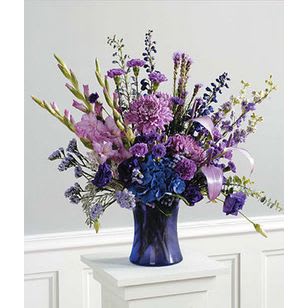 Royal Blues  - Lavender and blue flowers in a royal blue vase.