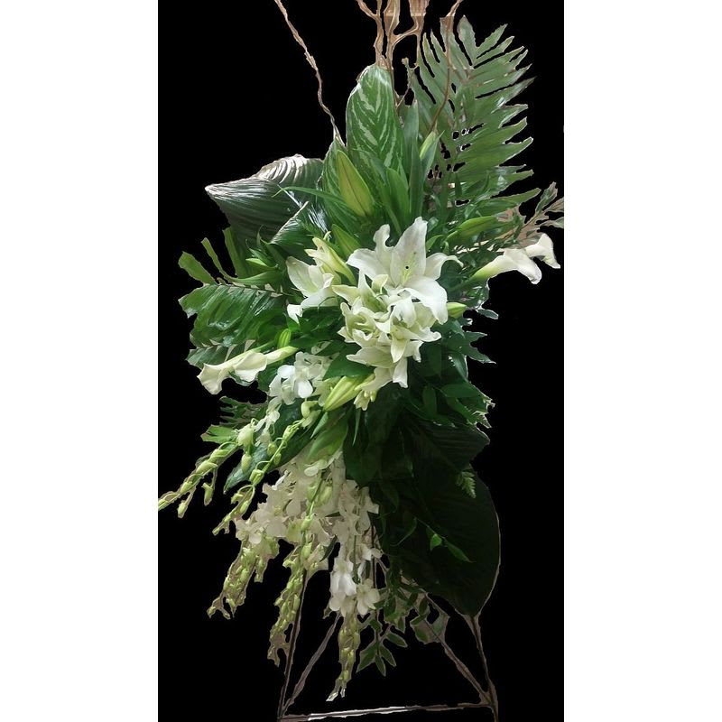 White Tropical Standing Spray - A graceful White Tropical Tribute of White Oriental Lilies, White Dendrobium Orchids and tropical Greens 
