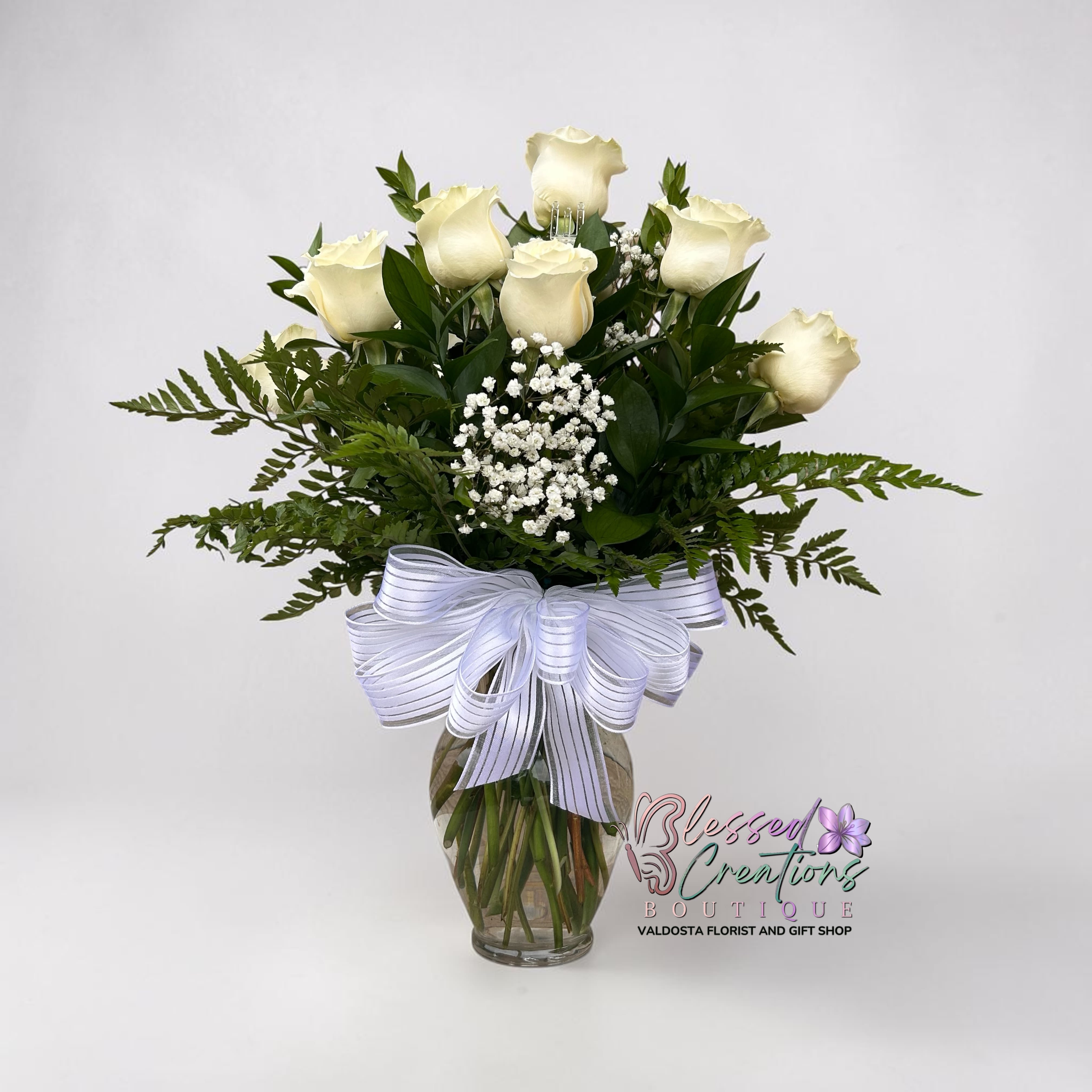 Purify Me  - A timeless arrangement of 12 fresh white roses, beautifully designed with lush greenery and babies baby’s breath.