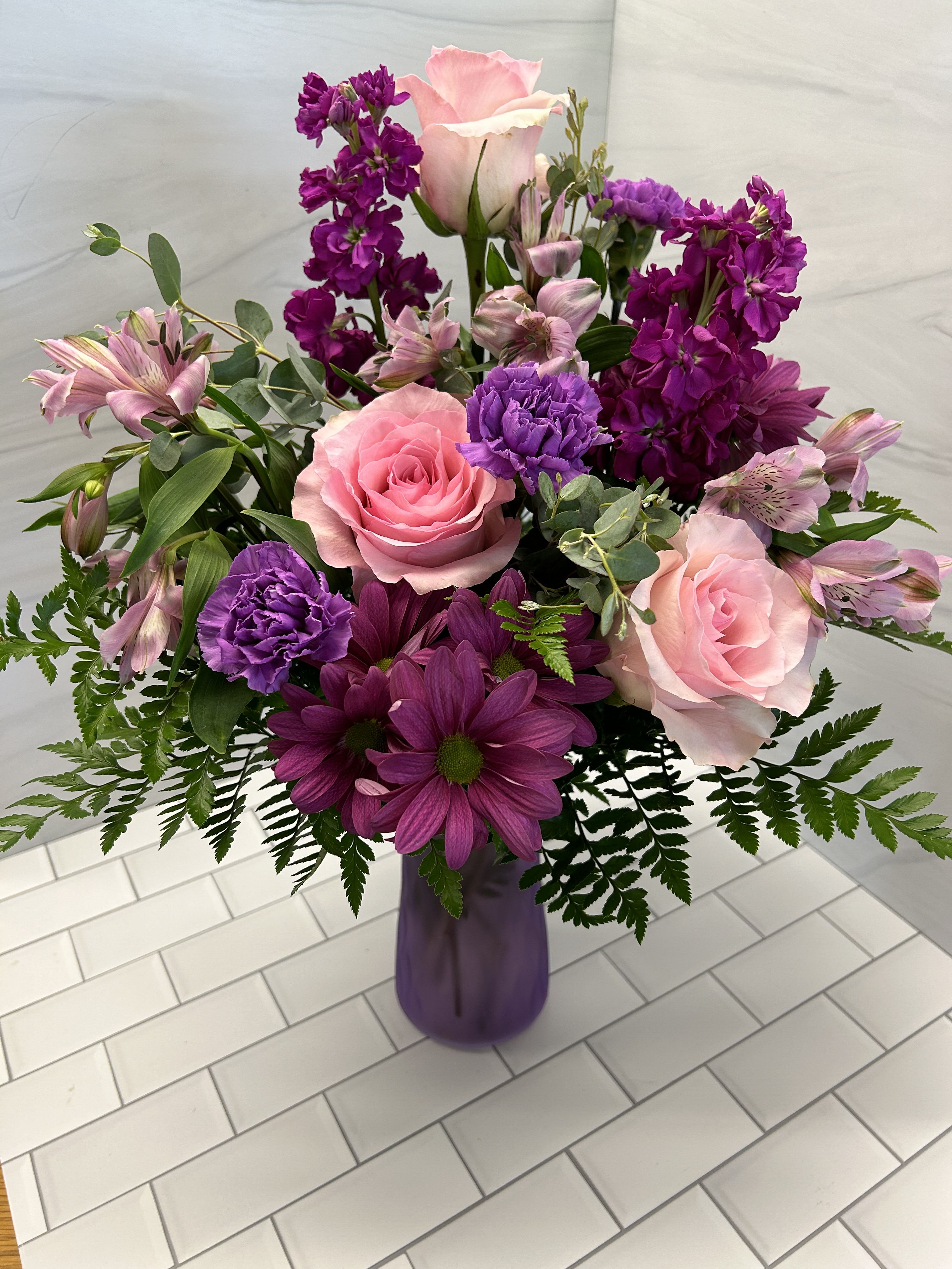 Momma's Garden - Send mom an arrangement that looks like it's straight out of her garden.  This vase showcases roses, daisies, alstroemeria, carnations, and stock.  Bouquet will be delivered approximately as pictured.