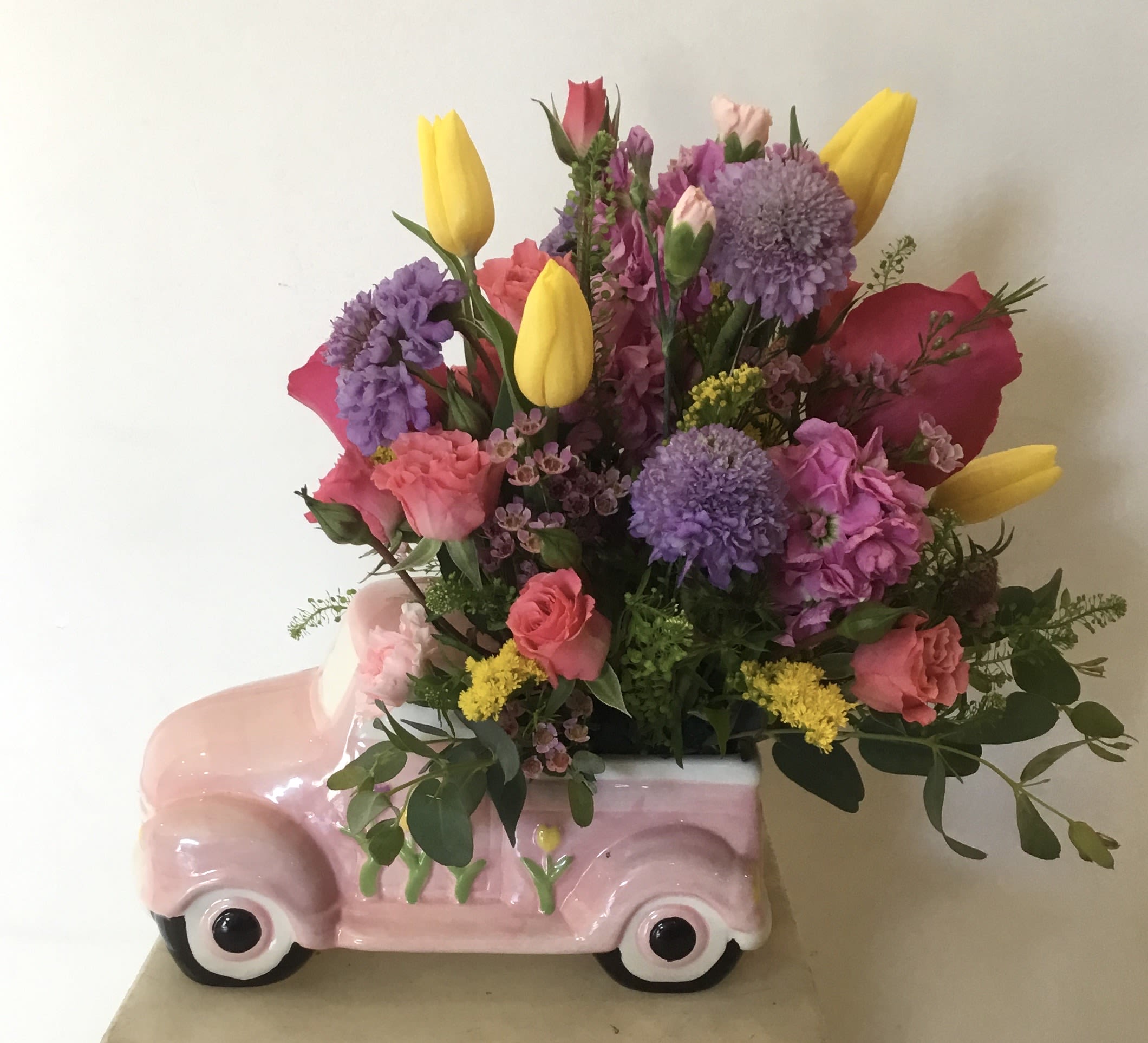 MOTHER TRUCKER BOUQUET  - Beautiful assortment of fresh blooms beautifully designed in a vintage ceramic pink pick up truck. 
