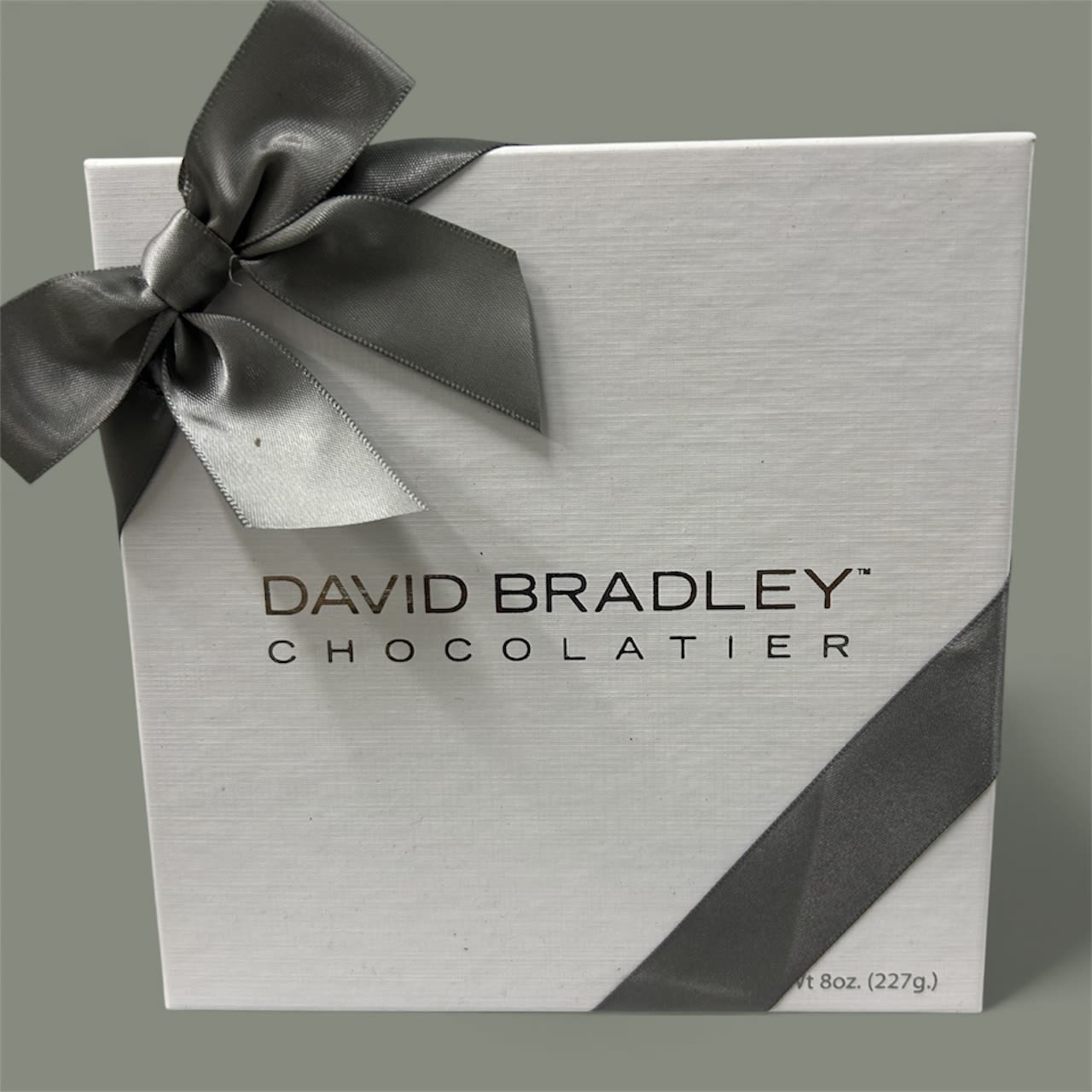 White chocolate gift box with a dark ribbon bow