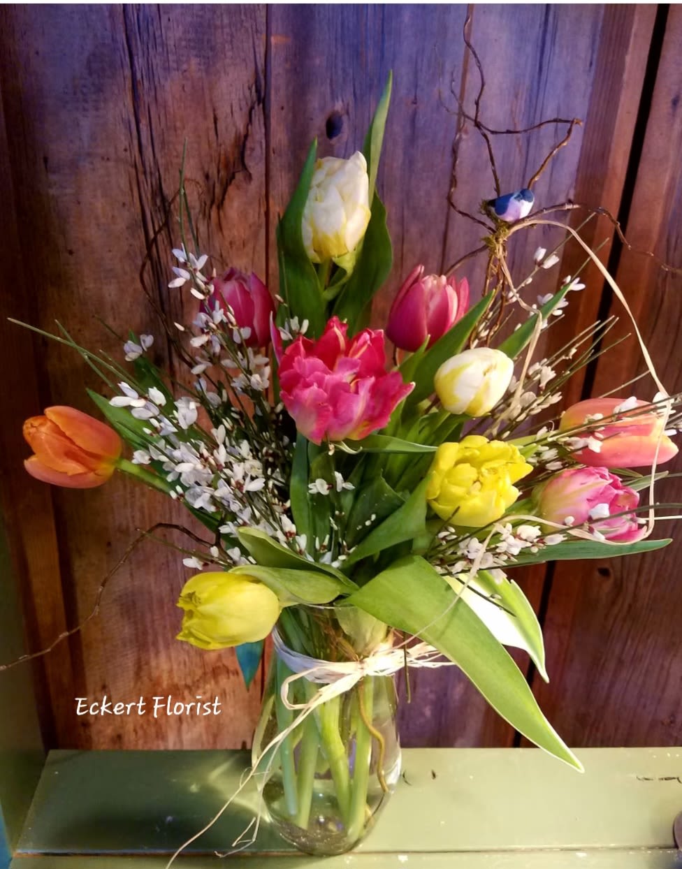Eckert Florist's Tulip Bouquet **LOCAL DELIVERY ONLY** - Spring has definitely sprung with this multi-colored bouquet filled with mixed colored tulips and a touch of accent flowers. Standard - 10 Tulips Deluxe - 15 Tulips Premium - 20 Tulips *Tulip colors and accent flower will vary  **LOCAL DELIVERY ONLY