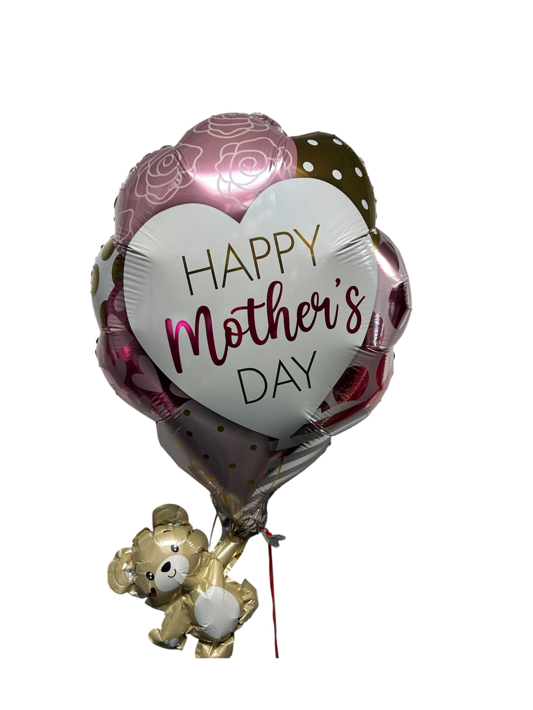 HAPPY MOTHERS DAY BALLON - A glossy heart-shaped foil balloon printed with "Happy Mother's Day" sets a joyful, celebratory tone for a Mother's Day bouquet or family celebration. The pink-and-white polka dot and floral-outline design catches the eye, while the attached small gold teddy bear balloon and coordinating ribbon add a playful, affectionate touch-perfect for the mom who loves whimsical, cheerful gifts.  Colors of pink, white, purple and yellow mingle through the presentation (ribbons and accents echo these hues) to create a warm, springtime palette that reads feminine and festive. The arrangement centers on the large heart balloon as the focal point; the teddy bear balloon brings an extra element of charm and keepsake appeal. Lightweight and bright, this piece is ideal for gifting alongside brunch or a small gathering and will look lovely displayed in an entryway or living room.  Designed to make mom feel celebrated and seen, this balloon arrangement works for Mother's Day, a birthday, or any family milestone when you want to send warmth and gratitude. Balloons arrive ready to display with decorative ribbon; for best enjoyment, keep away from sharp objects and indoors or in a sheltered outdoor spot to preserve the glossy finish.