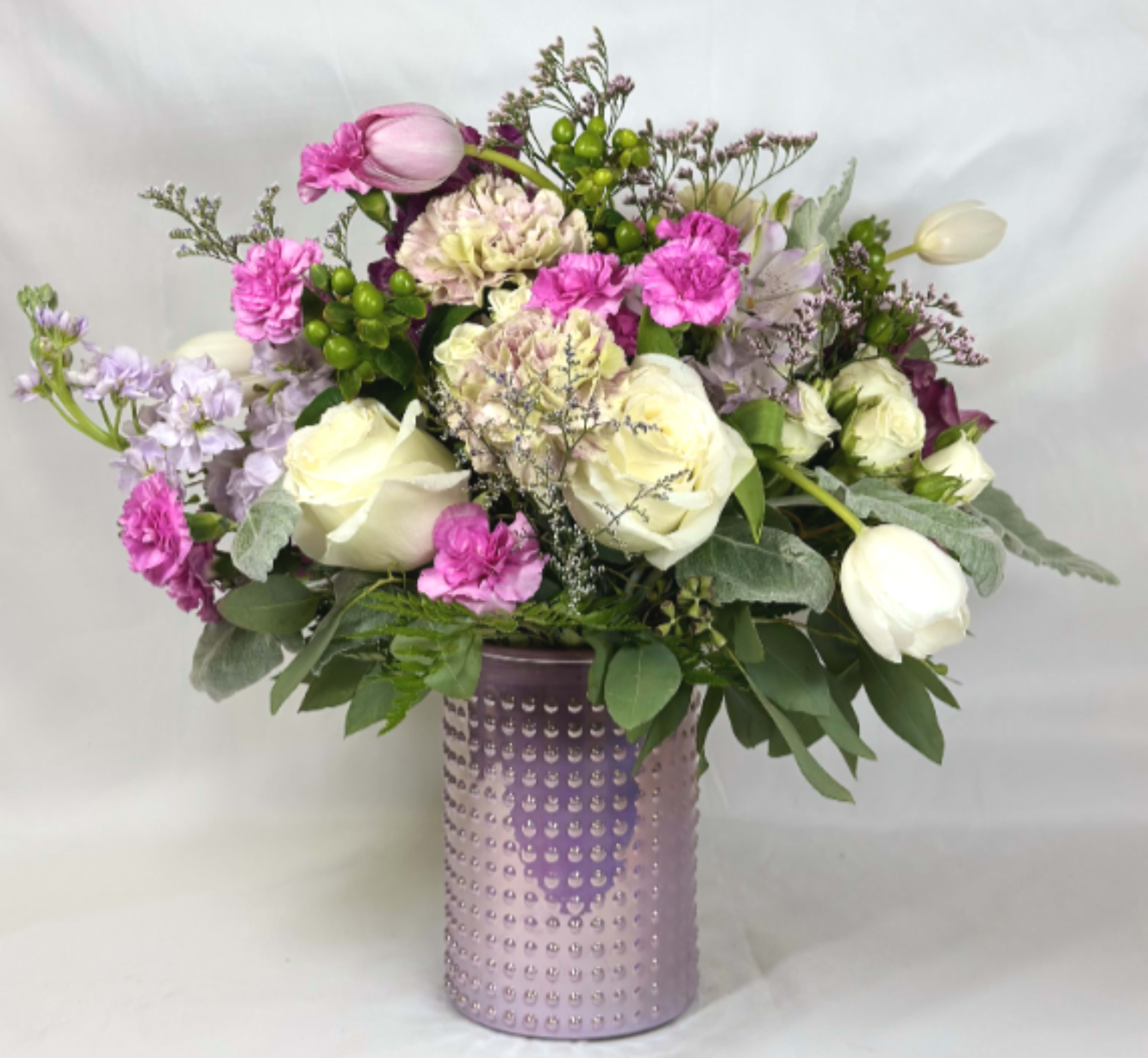 Pink Nostalgia - This Leary's Flowers exclusive design brings all the charm of a cottage garden and country summers,  These are flowers that will be loved by all generations, roses, hydrangeas, and carnations all blend together in a pink hobnail vase with a modern edge to rustic charm.  If the featured flowers are unavailable, we will design your arrangement using the freshest blooms of equal or greater value