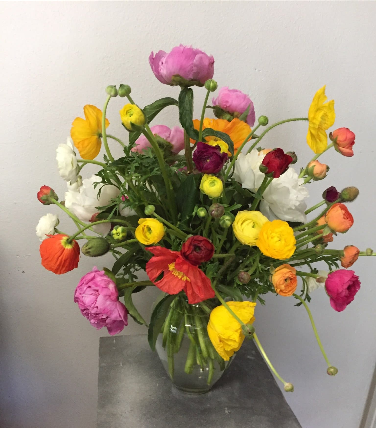 Colorful mixed bouquet in a clear glass vase