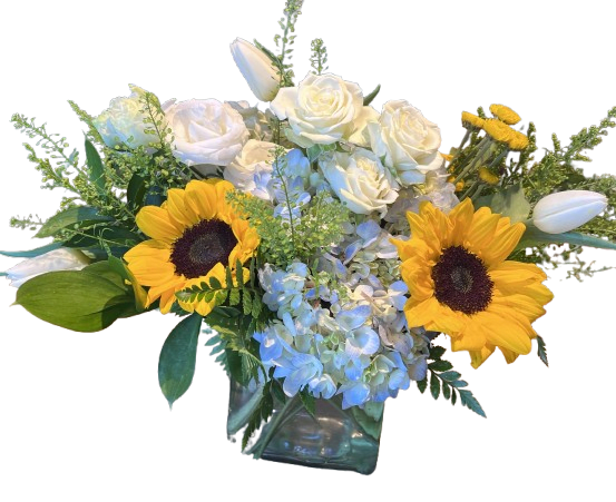 Sunshine by the Sea - Sunshine by the Sea is a fresh and uplifting arrangement inspired by warm coastal breezes and bright summer days. Featuring cheerful golden sunflowers, soft blue hydrangea, elegant white roses, and crisp white tulips, this design blends vibrant sunshine with calming ocean tones. Arranged in a modern clear glass cube vase, it’s a perfect gift to brighten birthdays, celebrate special moments, or bring a touch of seaside beauty into any home.