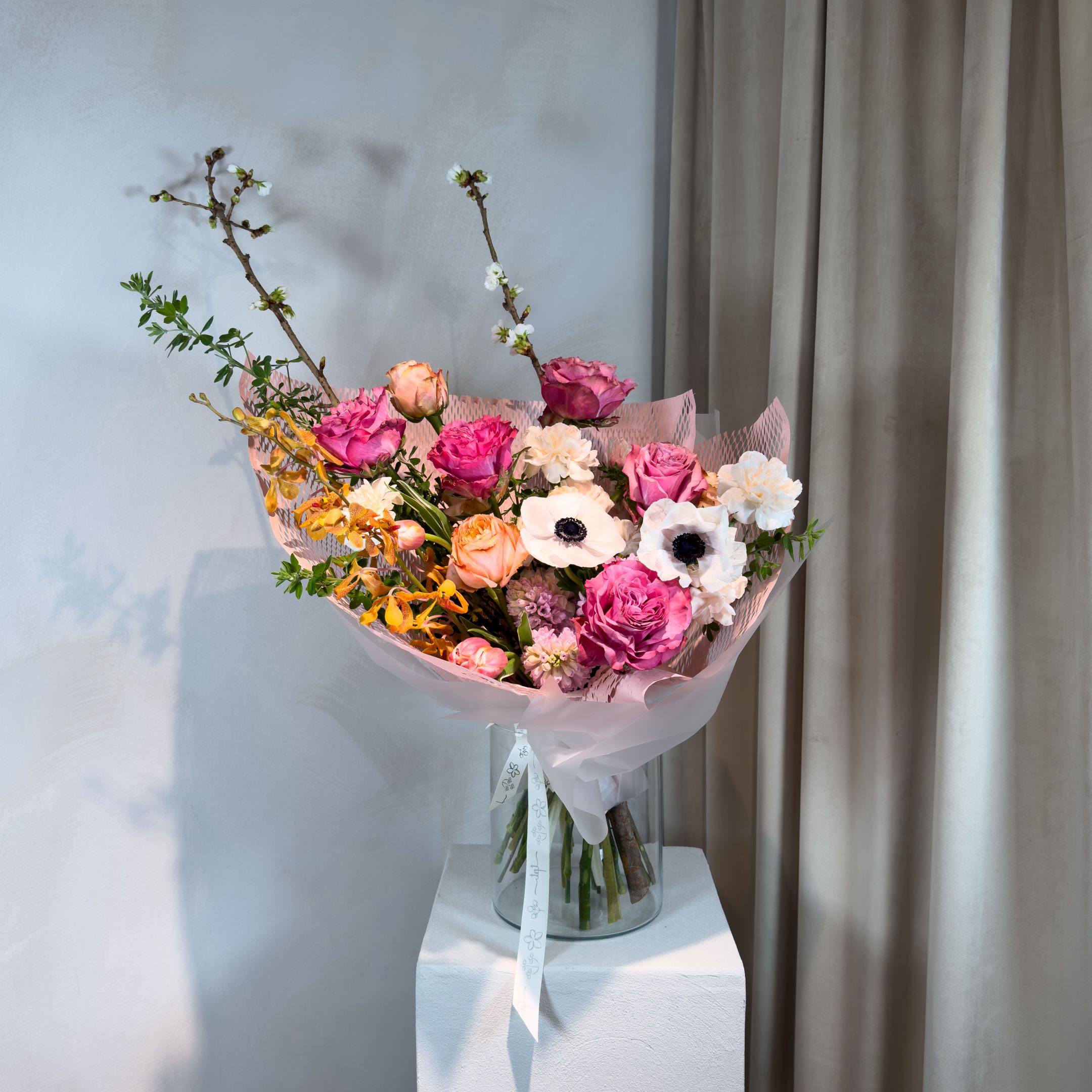 For Eomeoni in Maeum - A soft, seasonal bouquet in a blend of pink, peach, and white tones - bringing together classic and seasonal flowers in a warm, balanced palette. Designed intuitively, each arrangement is one of a kind, allowing texture, movement, and color to shape the final form.  What’s Included:  – Seasonal flowers in pink, peach, and white tones – Handwritten note + care instructions – Carry-out bag – Water source to keep stems fresh – Bouquets with 18+ stems include a water pouch for transport  Please Note:  Images are for inspiration only.  We do not replicate past designs or recreate another florist’s work. Each bouquet is uniquely handcrafted with care and intention.