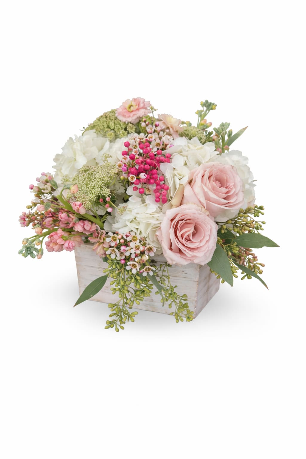 Pink roses and white hydrangeas in a white wooden box