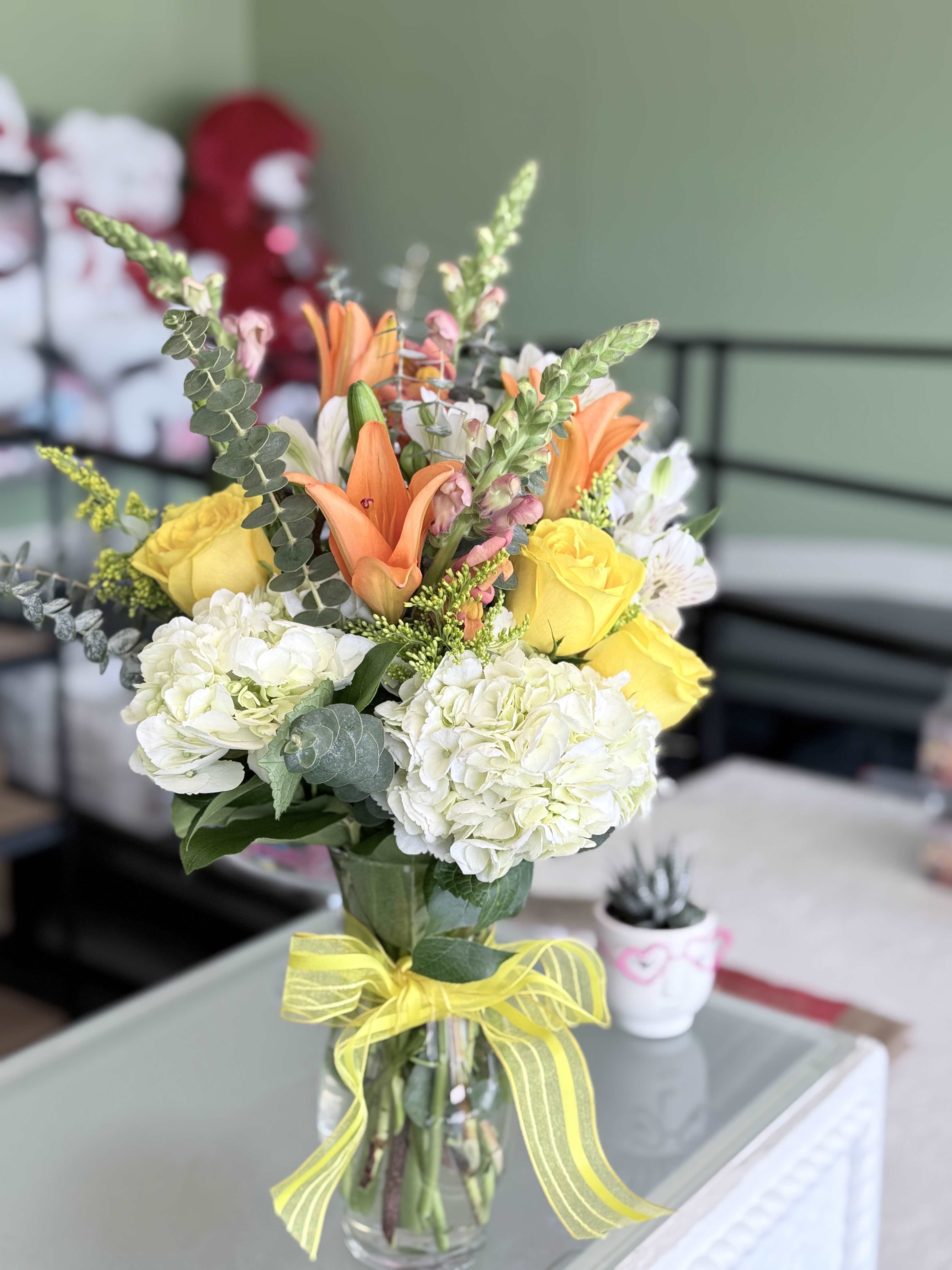 Vibrant vase - Yellow roses, hydrangeas, snapdragons, alstroeria, solid ago.