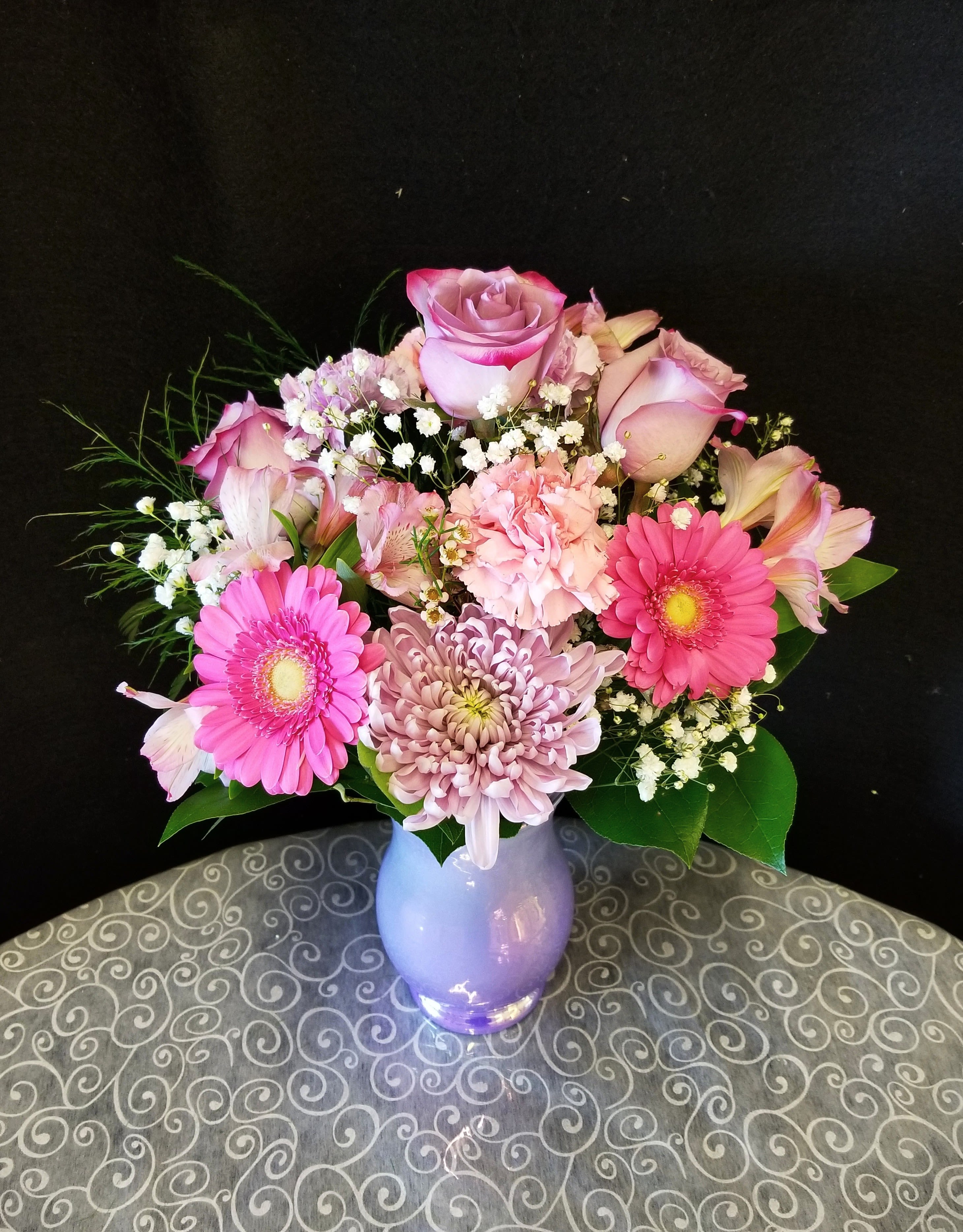 Lavender Lush - Shades of pink and purple blooms accented in an iridescent lavender vase