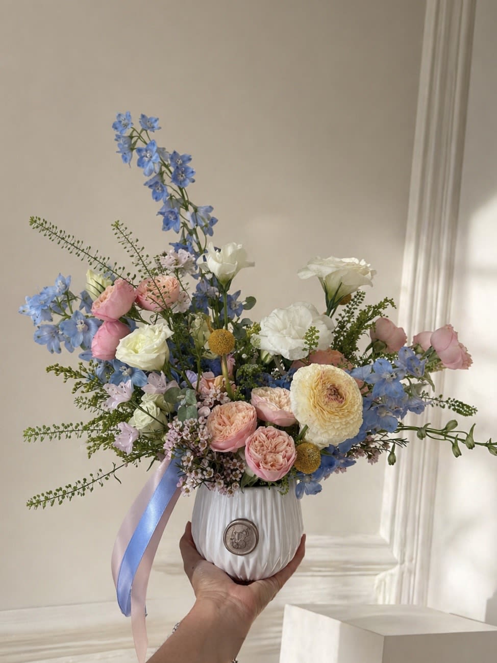 Blooming Surprise - This arrangement features a unique mix of fresh flowers, varying each week based on availability from our cooler. The image provided is a reference for size, though the colors and flower selection will change with each arrangement. Perfect for a wide range of occasions—whether you want to say thank you, wish someone a happy birthday, or simply brighten their day! 