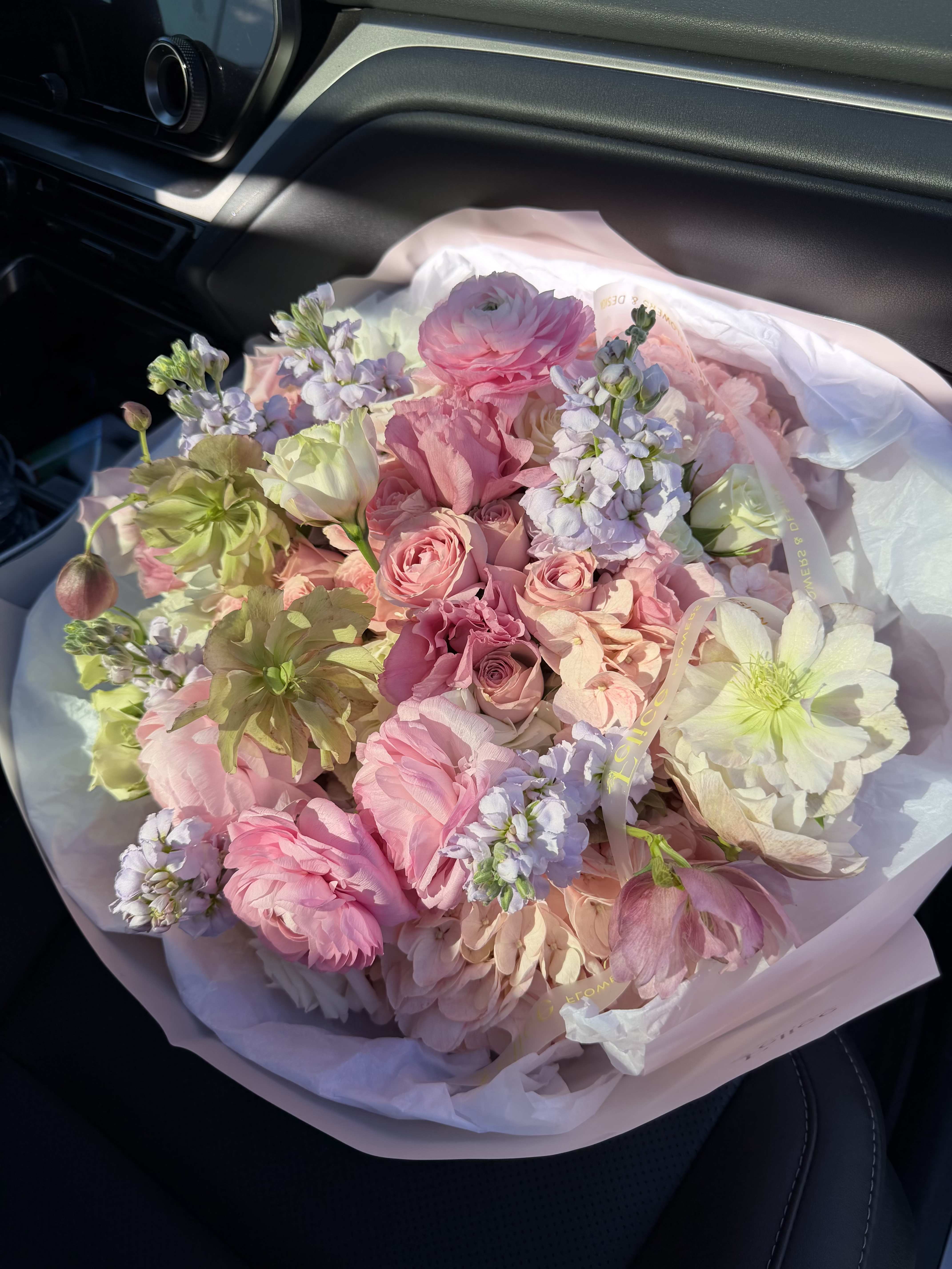 Premium Garden Style Bouqu - A luxurious garden-style bouquet featuring a delicate blend of blush pink, soft peach, and ivory blooms arranged in an organic, airy composition. This arrangement highlights premium flowers such as ranunculus, roses, hellebore, and seasonal accents, creating a natural, freshly gathered garden look. Designed with movement and texture, this bouquet feels soft, elegant, and effortlessly refined. Wrapped in premium paper and finished with signature Felice Flowers &amp; Design ribbon, it is perfect for those who appreciate modern floral design. Ideal for Birthday, Anniversary, Get Well, or stylish everyday gifting. Please note: flower varieties may vary due to seasonality while maintaining the same color palette and overall aesthetic.