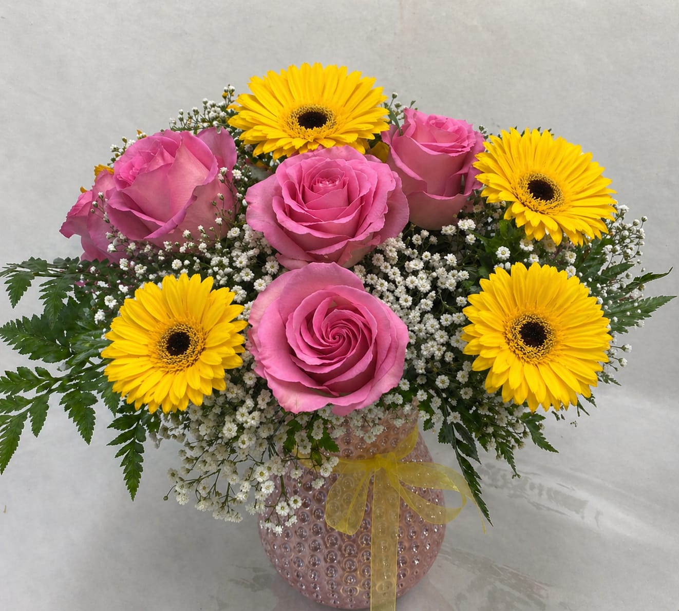 Happy Mother's Day!  - Mother's Day Special: Pink roses, yellow gerbera daisies, baby's breath &amp; complementary greenery in a cute pink glass vase. 