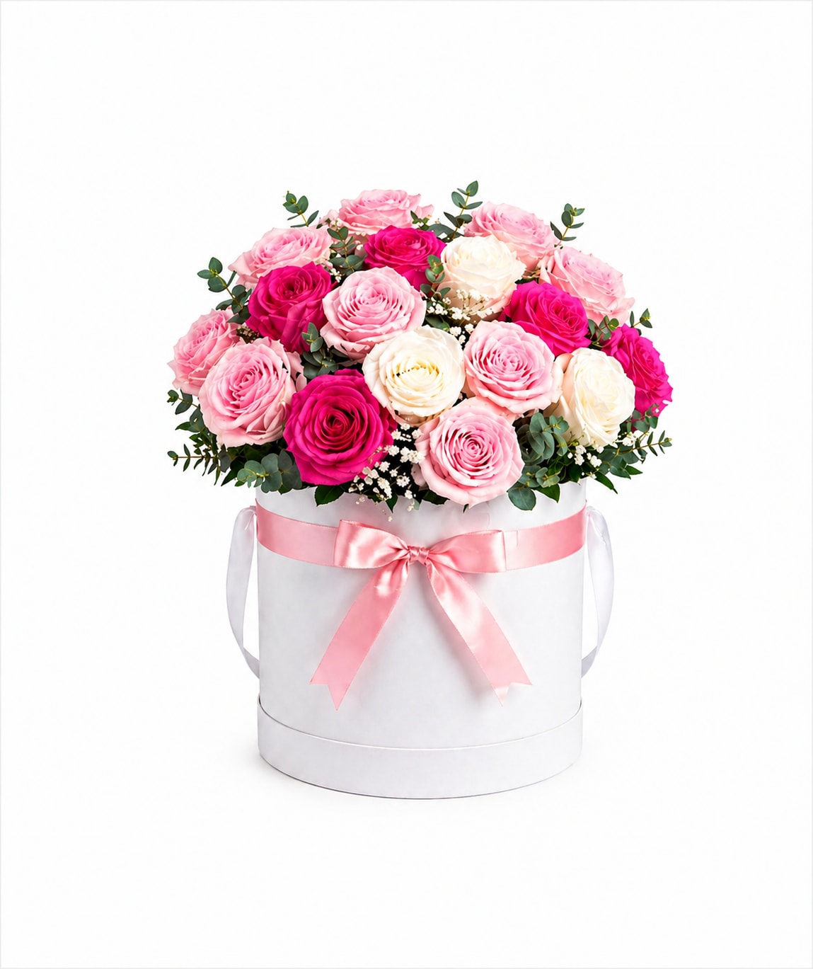 Pink and white roses arranged in a white hat box with a pink ribbon