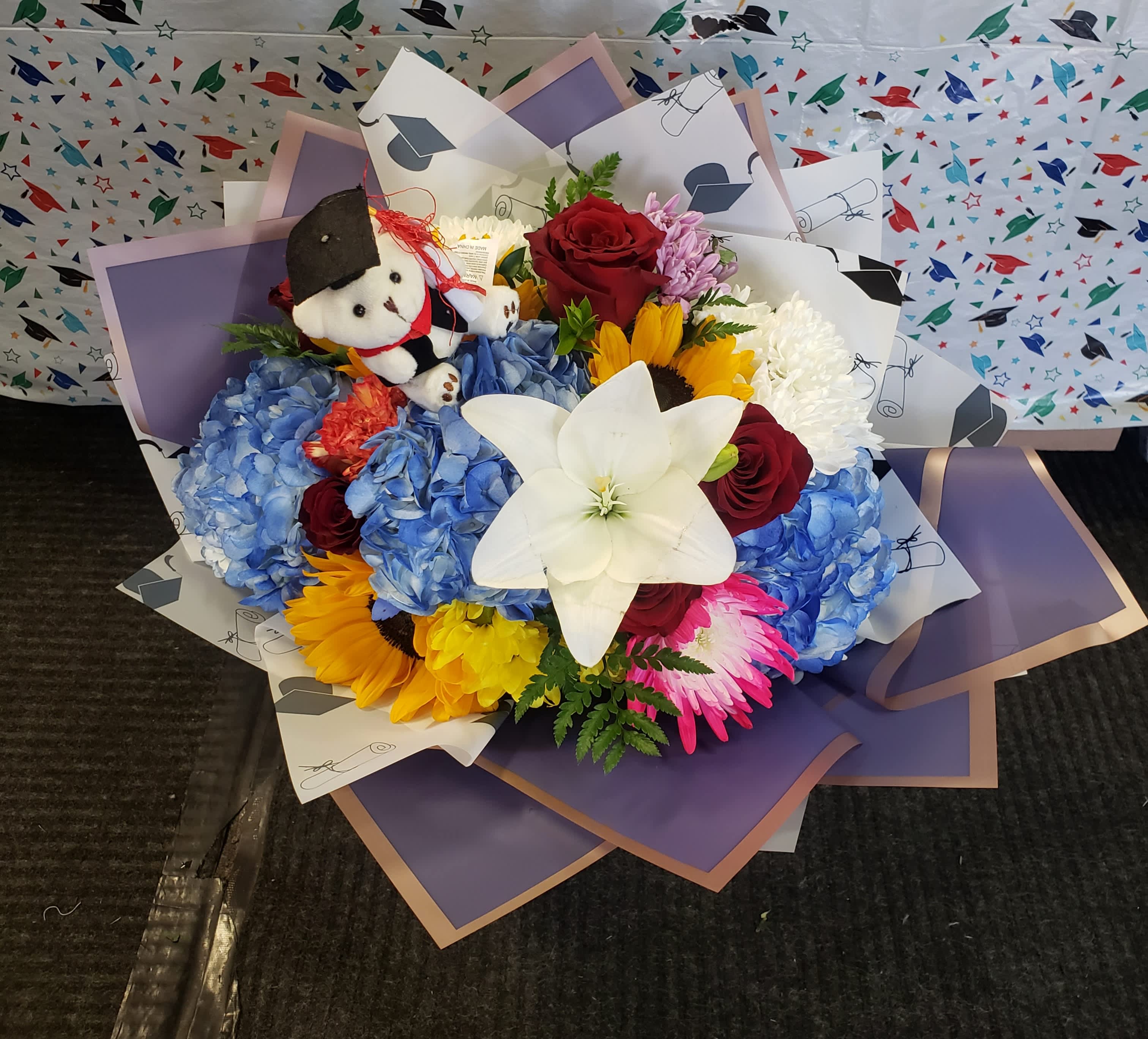   Graduation wrap bouquet - Blue and yellow wrap bouquet Burgundy and yellow is also available. Please specify color  in the special instructions box.