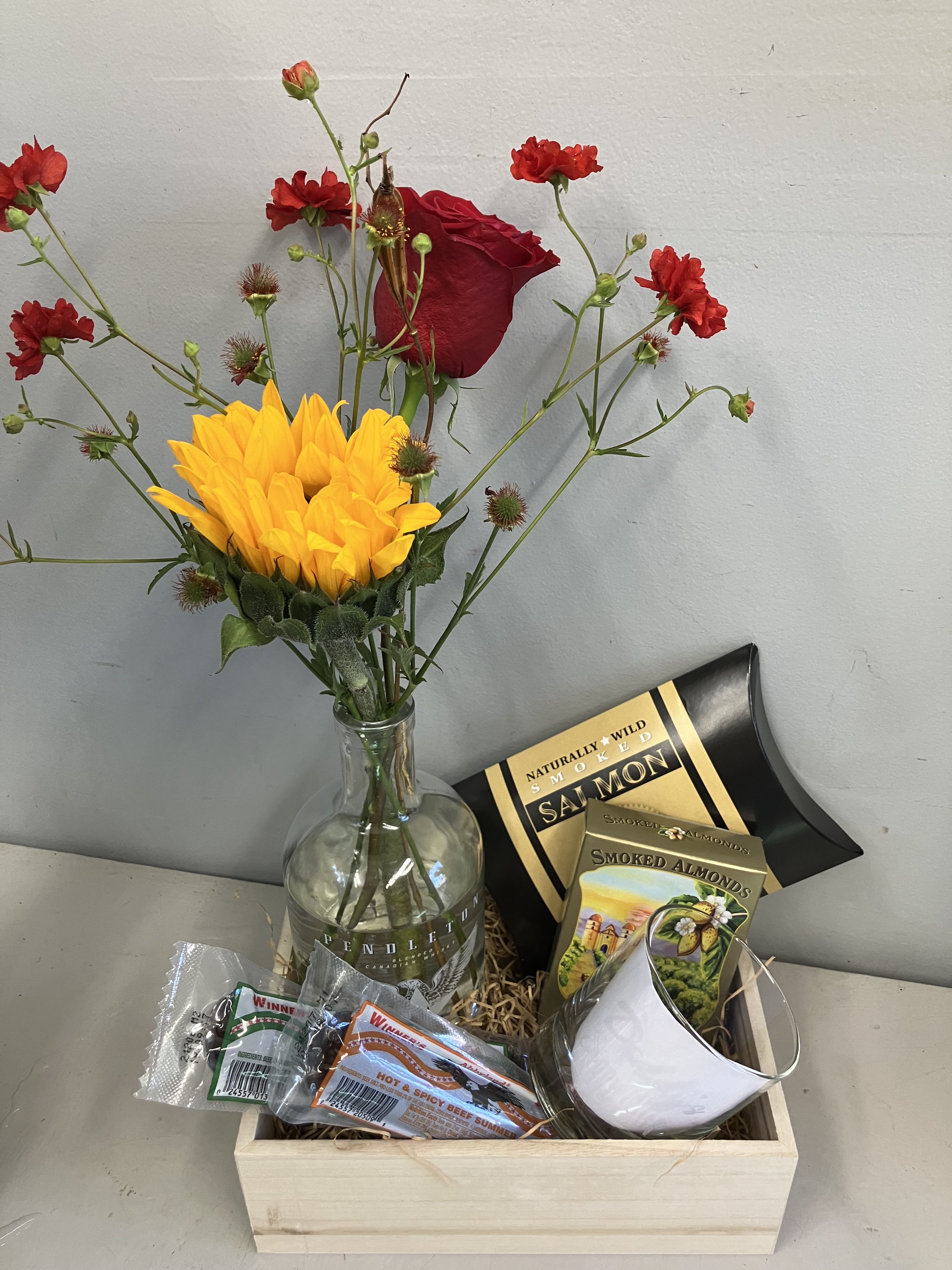 Fathers Day Gift Set - Fun gift for a dad that likes whisky, comes with a cup that says “daddy’s sippy cup” along with 2 flavors of summer sausage, savory salted almonds, salmon and a fresh flower arrangement in a Pendleton bottle