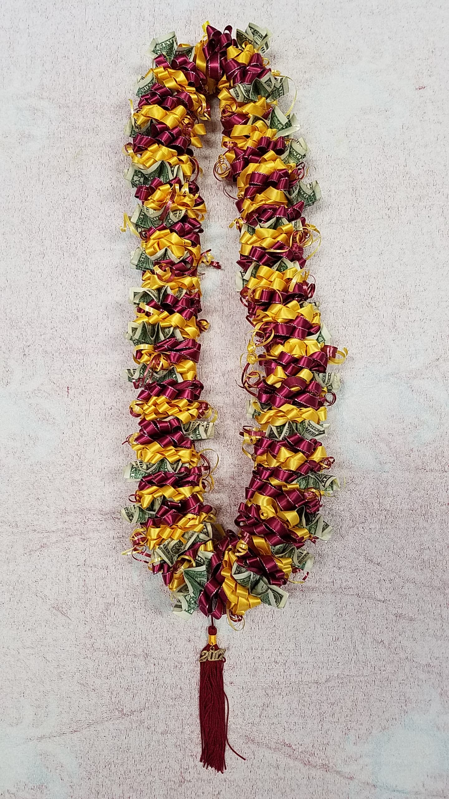 Money lei #6 - (30) $1 bills attached to fabric lei.REAL MONEY IS USE ON THE LEI, THERE IS NO RETURN AND NO REFUND ON THESE  LEI. ALL SALES ARE FINAL. COLOR OF THERE ARE MANY COLORS ARE AVAILABLE, PLEASE CALL FOR MORE INFORMATIONS