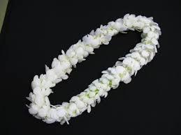 White flower lei on a black background