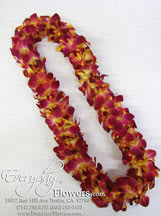Two magenta and yellow orchid leis on a white background