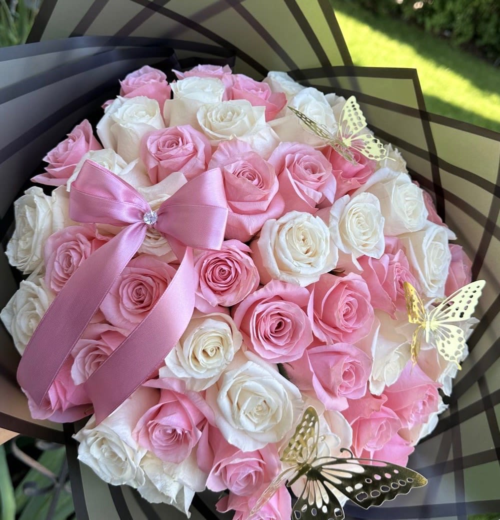 Pink and White Bouquet  - A beautiful bouquet of 18 fresh roses in a soft blend of white and pink, perfect for any special occasion. This arrangement combines the timeless elegance of white roses—symbolizing purity and new beginnings—with the gentle charm of pink roses, representing admiration and sweetness. Carefully selected and arranged, these blooms create a romantic and graceful display that’s ideal for birthdays, anniversaries, or simply brightening someone’s day. Fresh, vibrant, and full of meaning, this bouquet is a thoughtful gift that speaks from the heart.