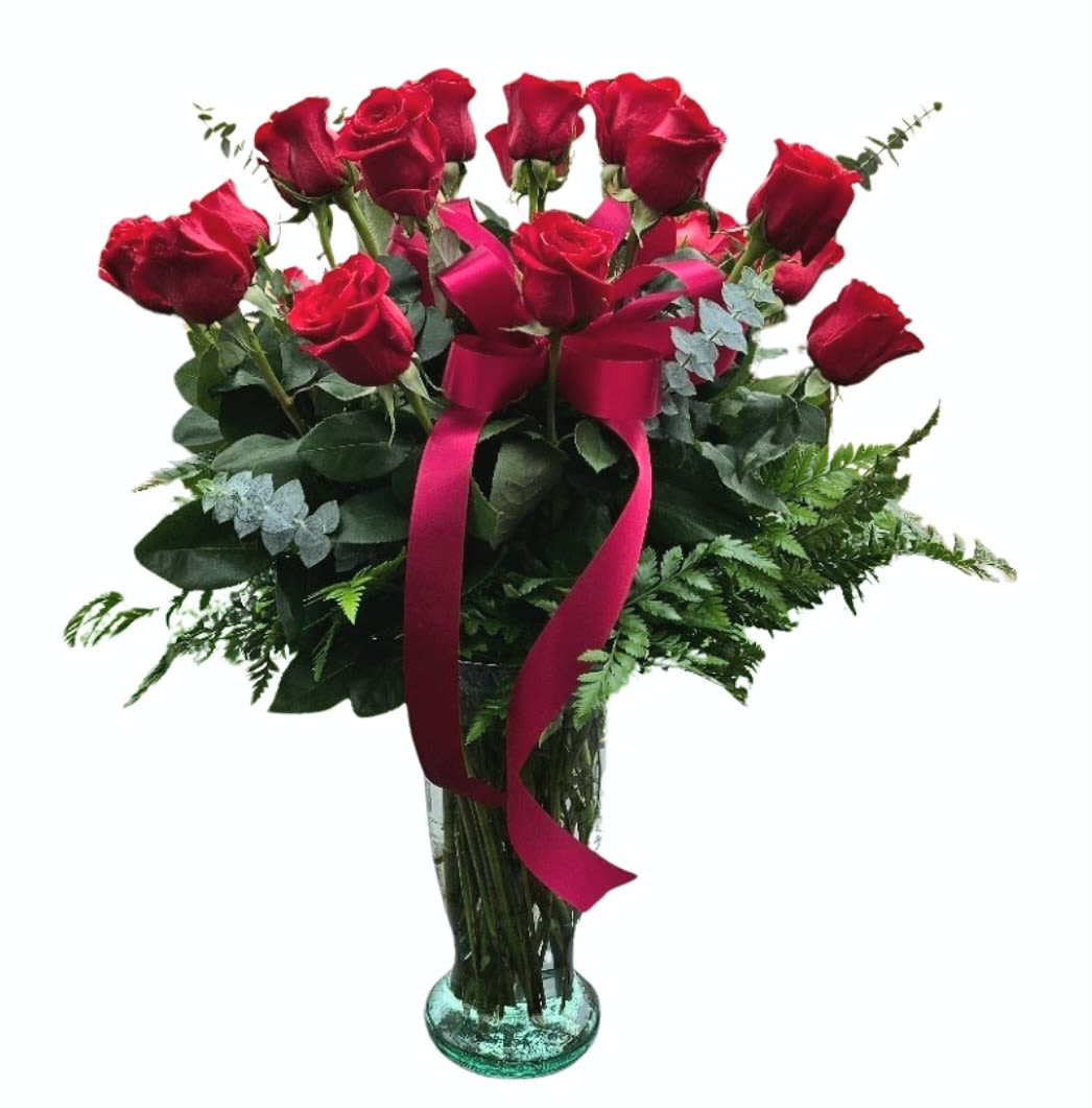 1 Dozen Premium Red Rose Arrangement         - Beautiful premium red roses arranged in a vase.