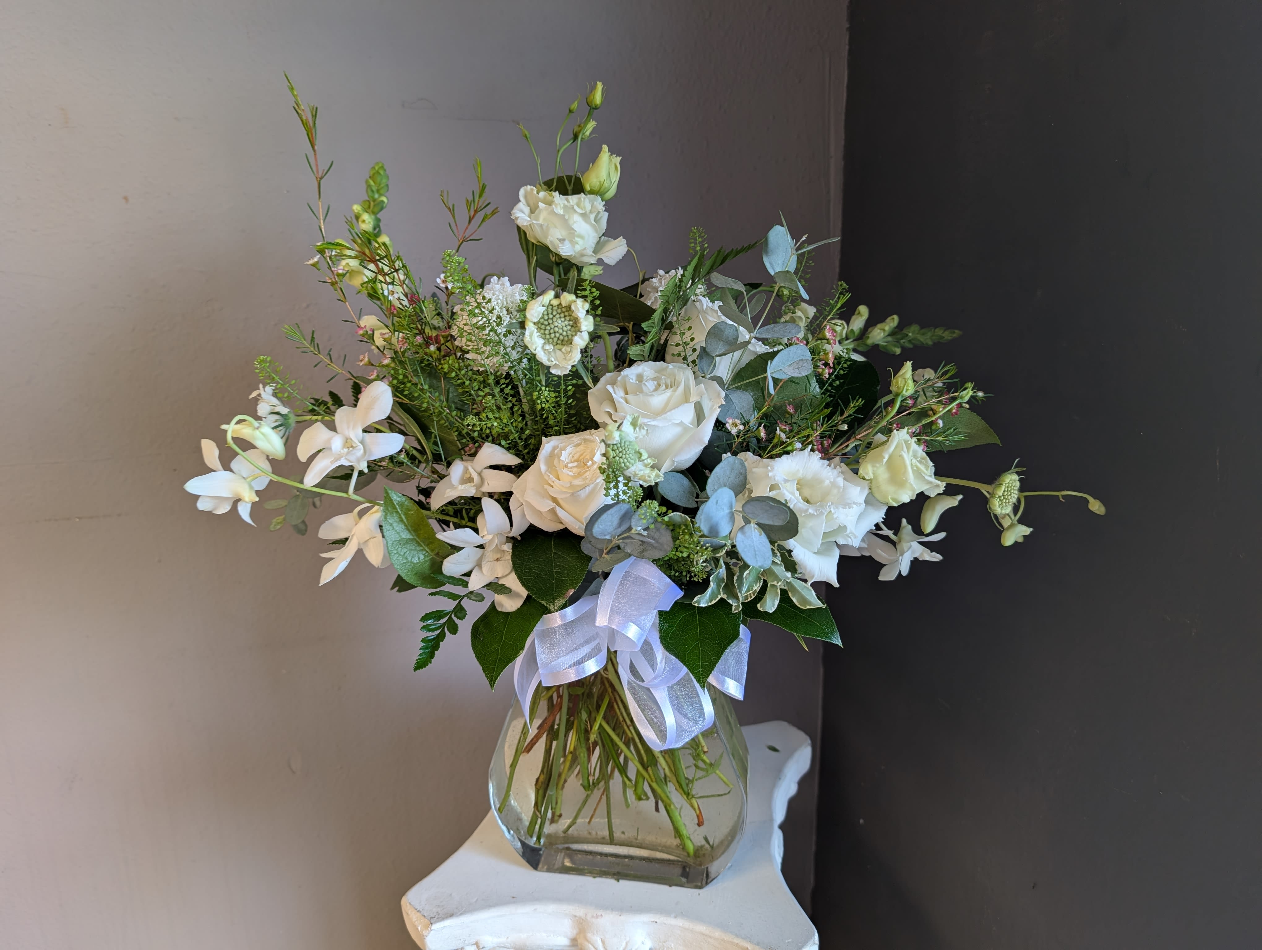 #715 Designer's Choice  - This beautiful flower arrangement of fresh mixed seasonal blooms is made by local designers in the heart of Orange California. Hand crafted and perfect for every occasion, from birthdays and new babies to sympathy and just because. The best choice to show you are thinking of that special someone. Can be sent as a local delivery or in-store pickup. This is an original, one of a kind arrangement. Order now before it's too late!