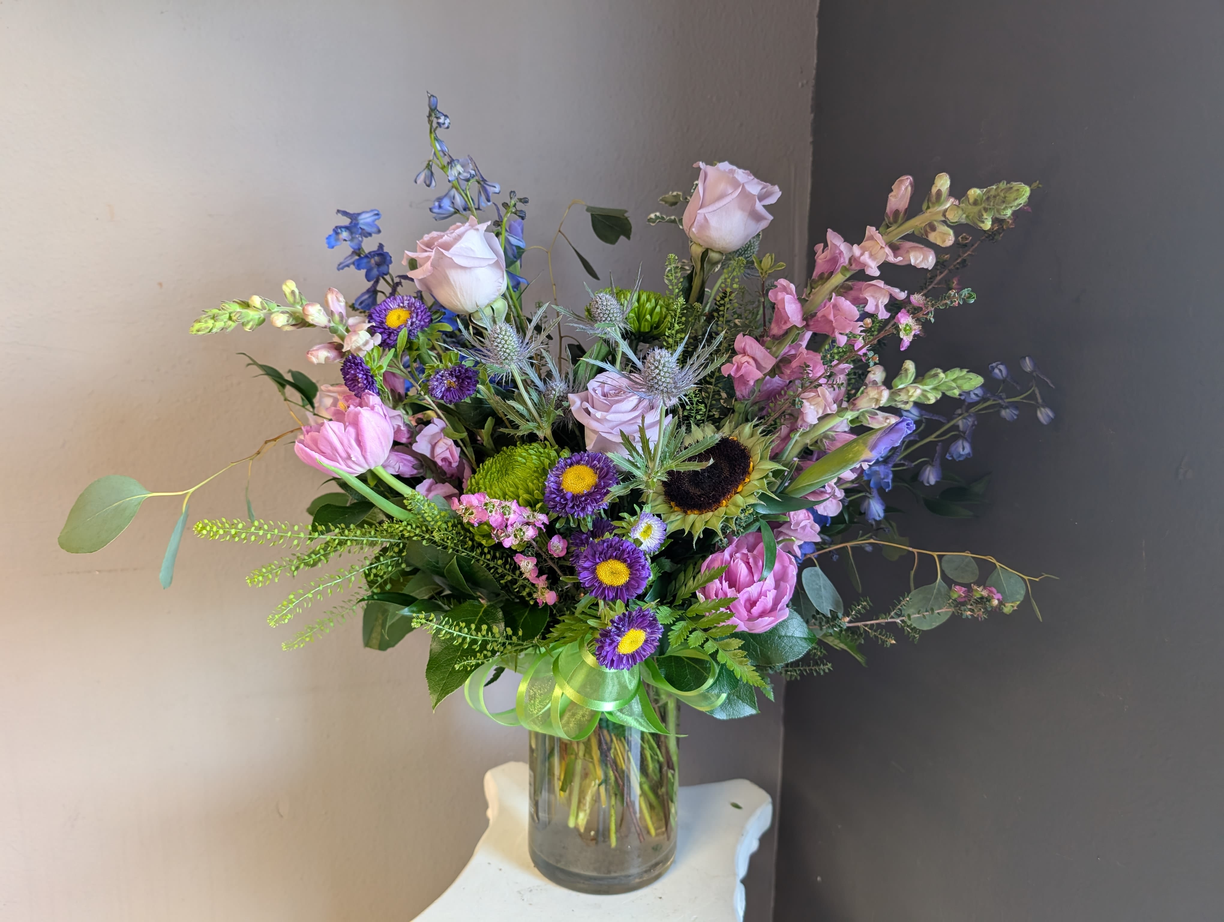 #724 Designer choice vase arrangement  - This beautiful flower arrangement of fresh mixed seasonal blooms is made by local designers in the heart of Orange California. Hand crafted and perfect for every occasion, from birthdays and new babies to sympathy and just because. The best choice to show you are thinking of that special someone. Can be sent as a local delivery or in-store pickup. This is an original, one of a kind arrangement. Order now before it's too late!  UPGRADES: All upgrades are applied at the designer’s discretion and fulfilled to value using the freshest seasonal and/or premium flowers available. Container upgrades may be included when possible; otherwise, value is reflected in the floral selection while maintaining the original design style.