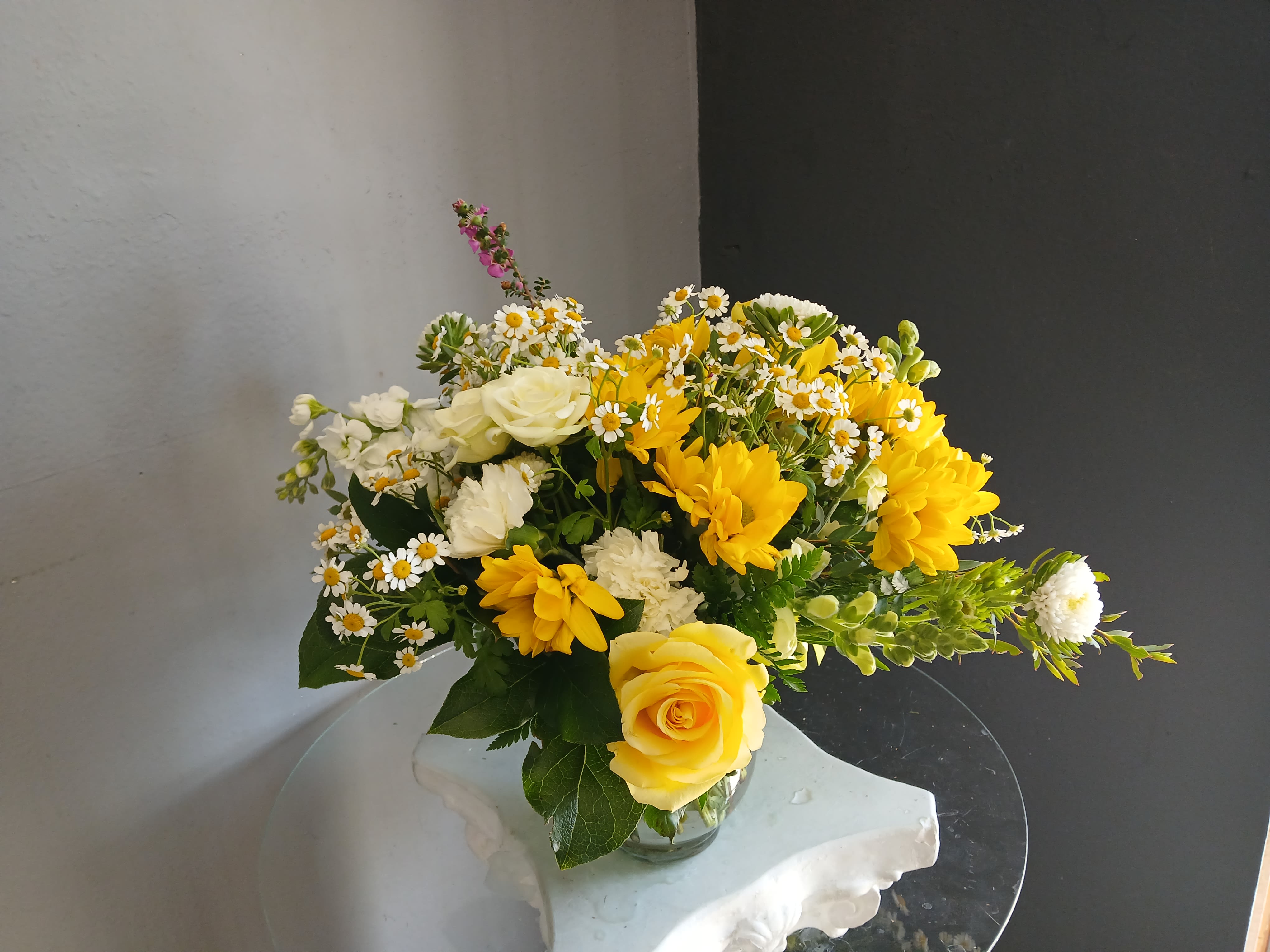 #702 Designer's Choice Vase Arrangement - This beautiful flower arrangement of fresh mixed seasonal blooms is made by local designers in the heart Orange California. Hand crafted and perfect for every occasion, from birthdays and new babies to sympathy and just because. The best choice to show you are thinking of that special someone. Can be sent as a local delivery or in-store pickup. This is an original, one of a kind arrangement. Order now before it's too late!  UPGRADES: All upgrades are applied at the designer’s discretion and fulfilled to value using the freshest seasonal and/or premium flowers available. Container upgrades may be included when possible; otherwise, value is reflected in the floral selection while maintaining the original design style.