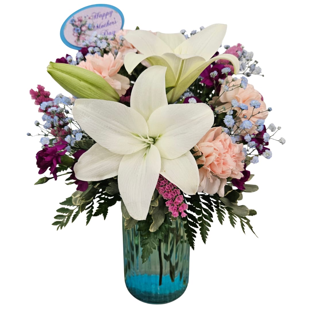 Lily Love - Beautiful white lily blooms surrounded by pink carnations, pink statice and blue baby's breath.