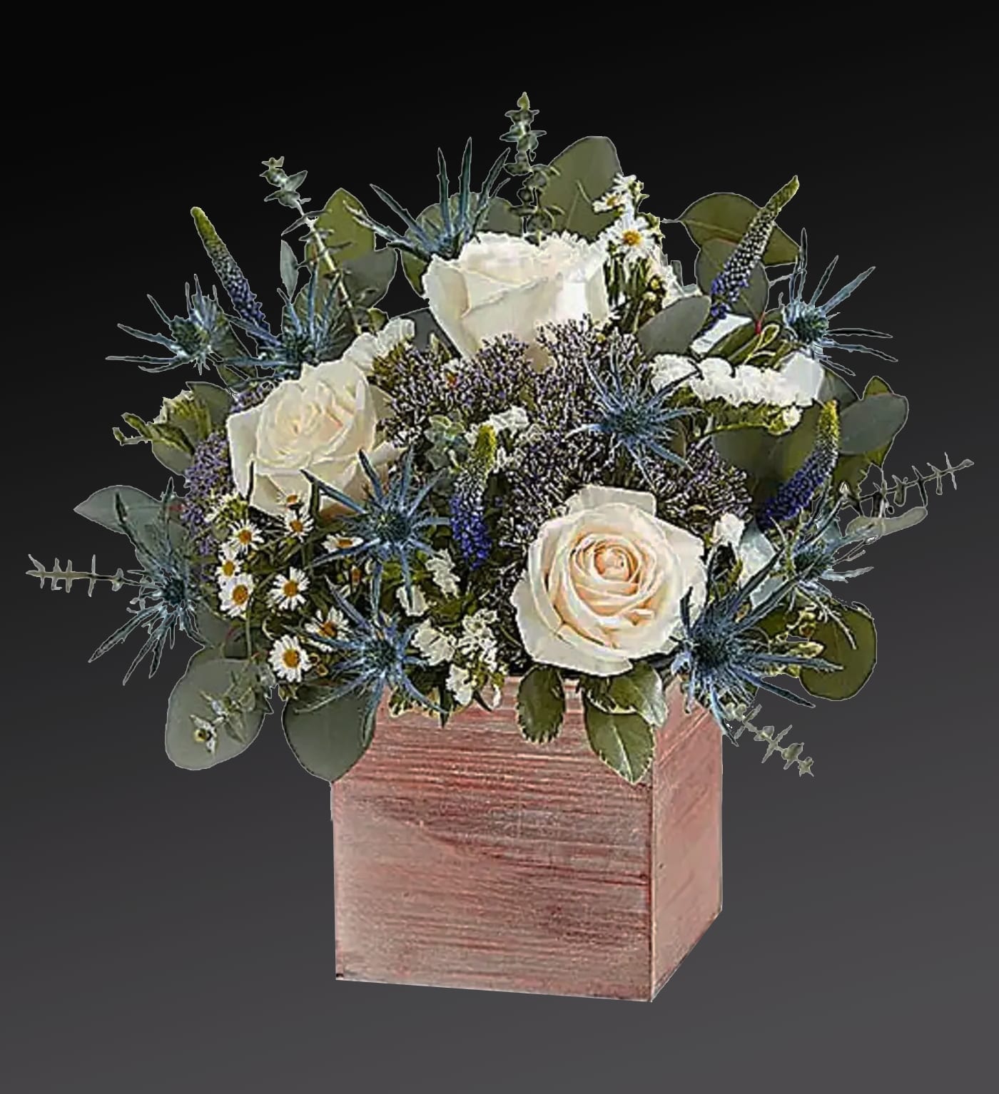 White roses and blue thistle in a pink wooden box