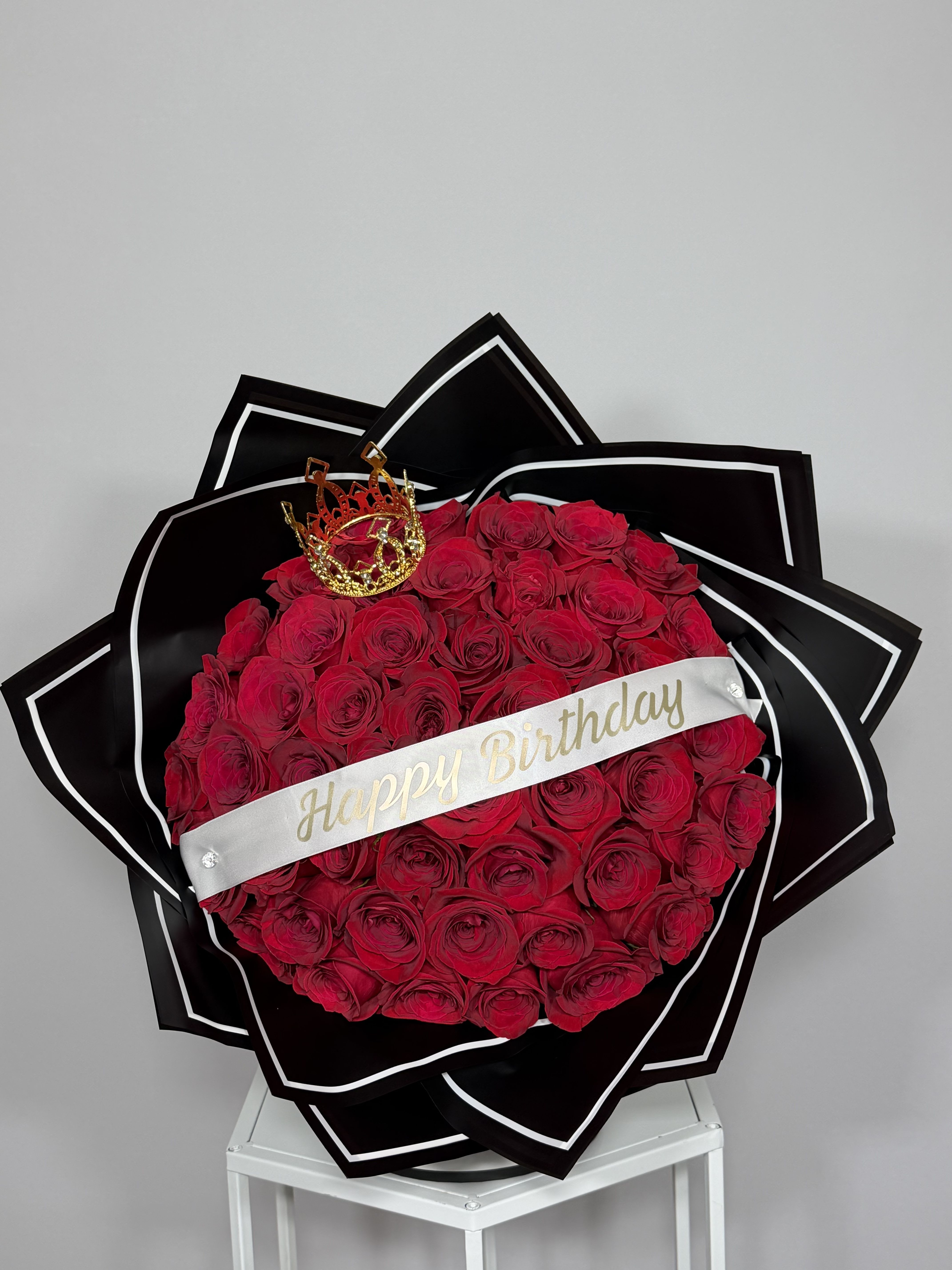 Midnight Birthday Bouquet - Natural Red roses wrapped in black with a white edge, made for a unforgettable birthday. Simple, elegant, and made to stand out.